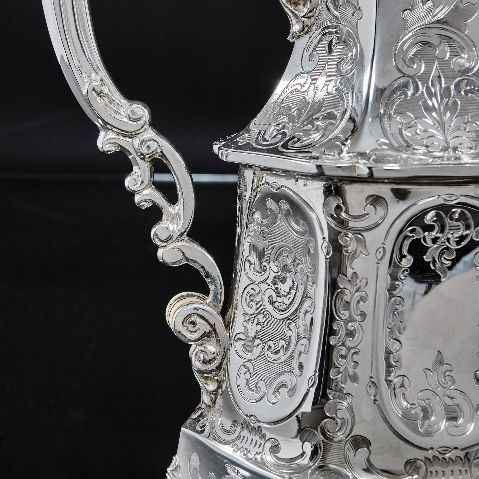 An imposing handmade antique silver tea and coffee set, comprising silver teapot, coffee pot, sugar bowl and milk jug, all hand engraved with fine detail and epitomising the exuberance of the mid-Victorian era and the influences of the