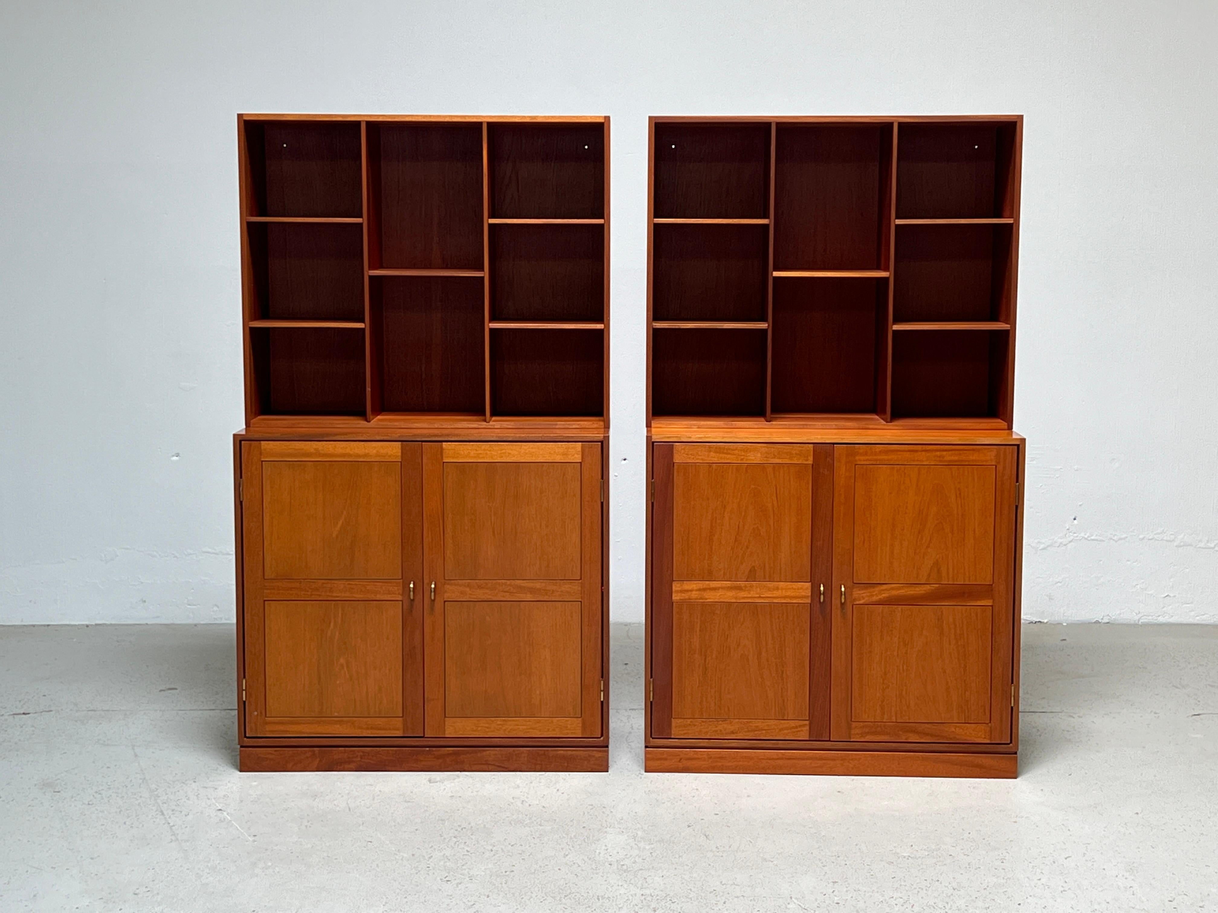 A four piece teak wall unit with brass hardware. Bookshelves with adjustable shelving. Designed by Christian Hvidt for Soborg.
