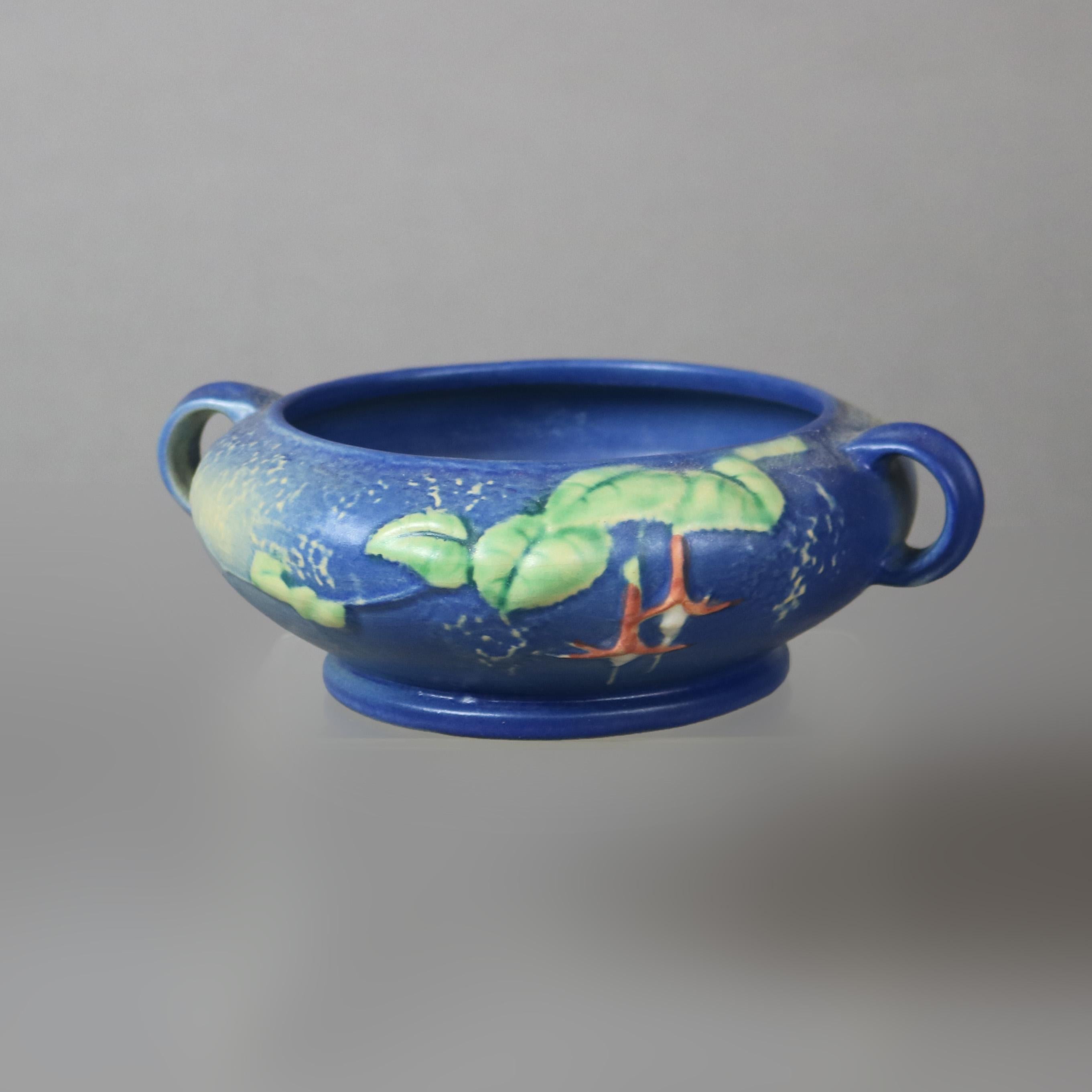 Four Pieces of Blue Roseville Art Pottery with Fuchsia Pattern Mid 20thC

Measures - 8.5