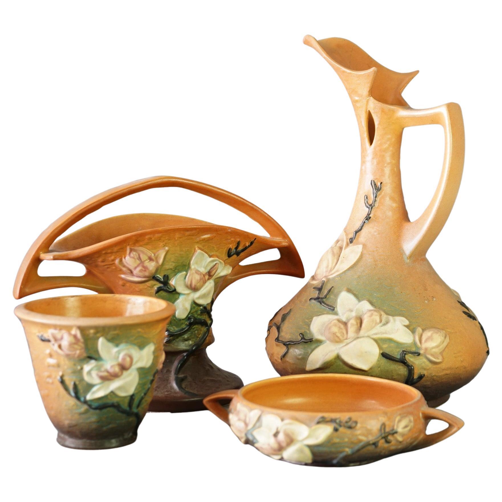 Four Pieces of Brown Roseville Art Pottery with Magnolia Pattern Mid 20thC