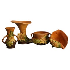 Four Pieces of Brown Roseville Art Pottery with Water Lily Pattern Mid 20thC