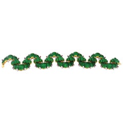 Four pieces parure set (necklace, bracelet and pair of earrings) in yellow gold