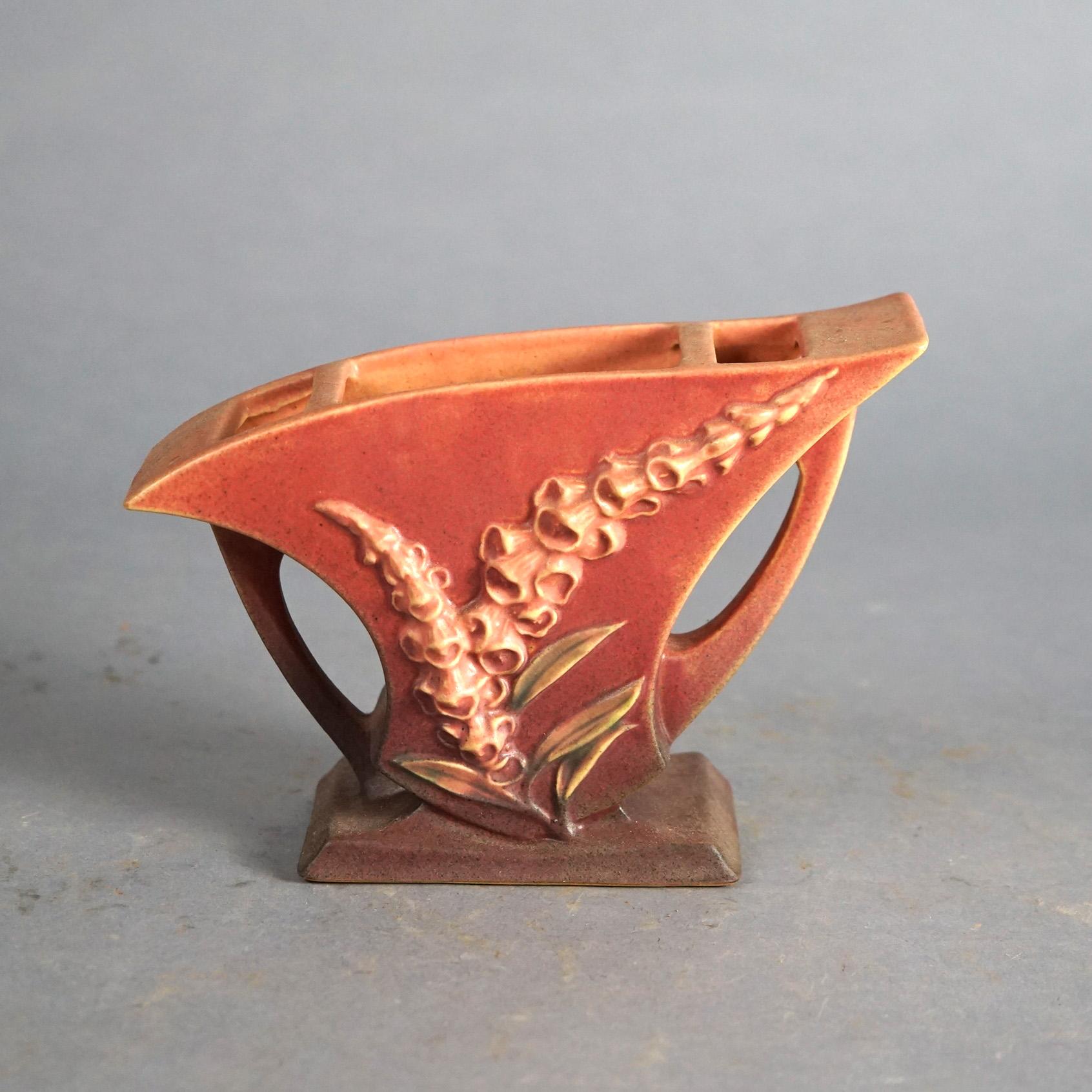 Four Pink Roseville Art Pottery with Foxglove Pattern Mid 20thC

Measures- Flare Vase: 6''H x 6''W x 5''D
