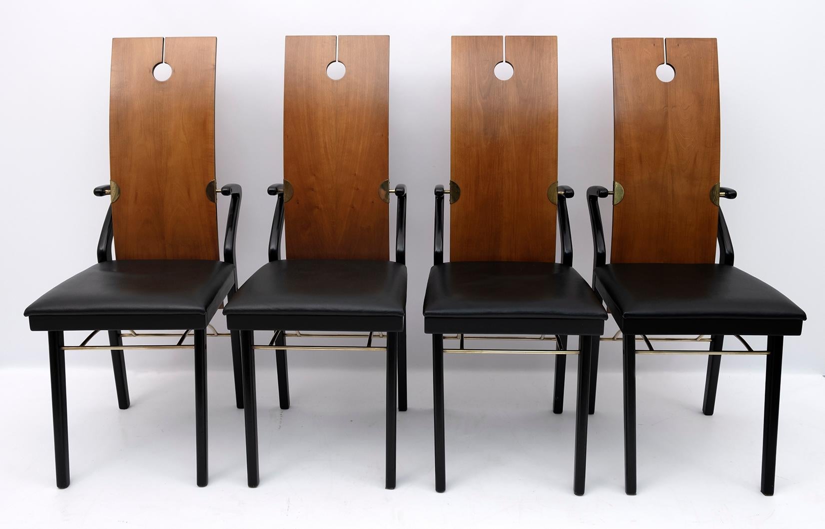 Four dining chairs by Pierre Cardin, 1980s. Absolutely rare production designed by Pierre Cardin in Italy. Back in curved cherry with a cut and a hole that makes it absolutely unique, seat and legs always in cherry but painted black. The seat is