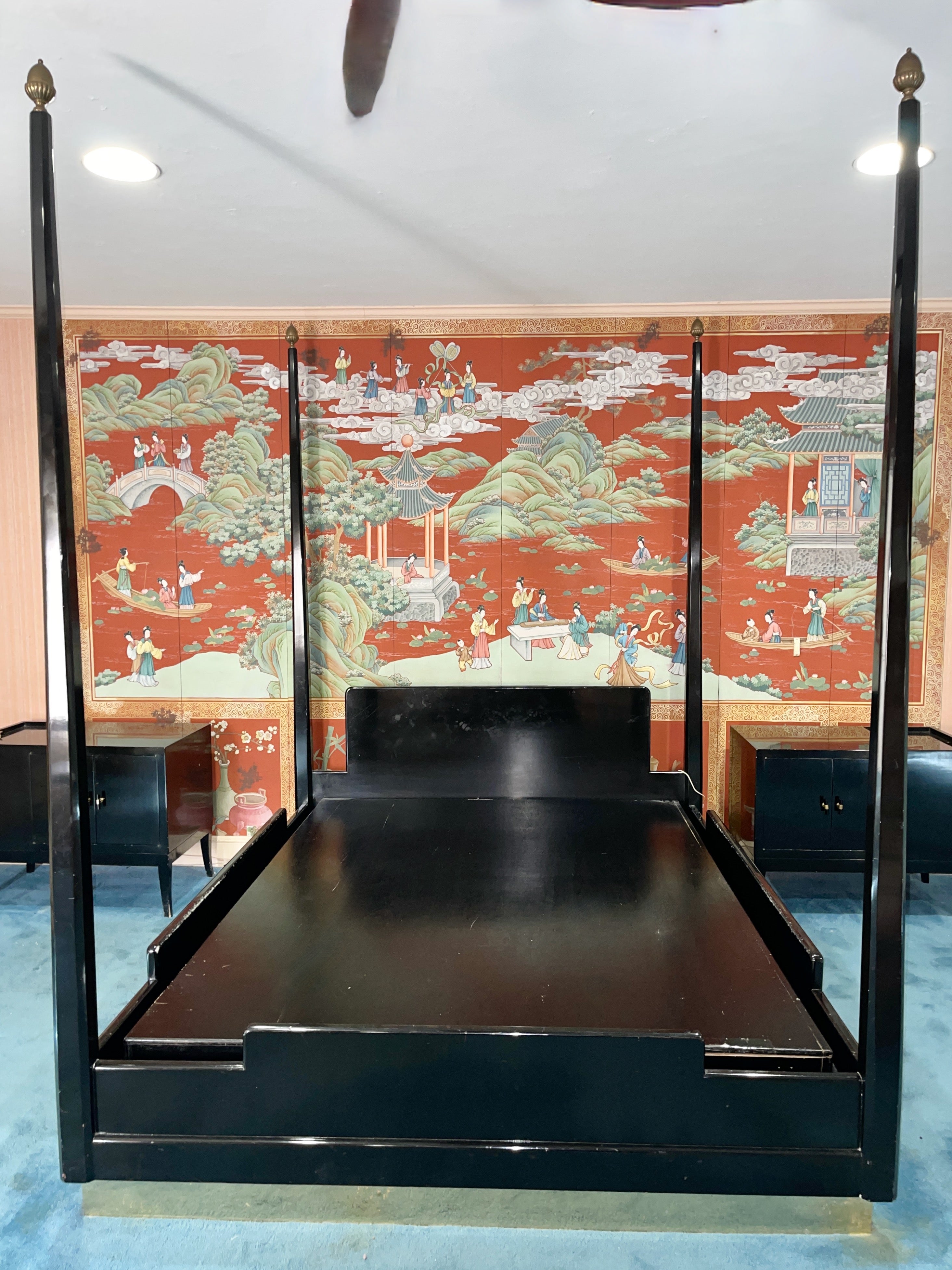 Vintage custom queen size four poster bed after a design by Tommi Parzinger (see last image for an image from a 1950's Good Housekeeping magazine). 
Gloss black lacquered wood bed mounted to a 4 inch plinth base clad in polished brass.
Shaped
