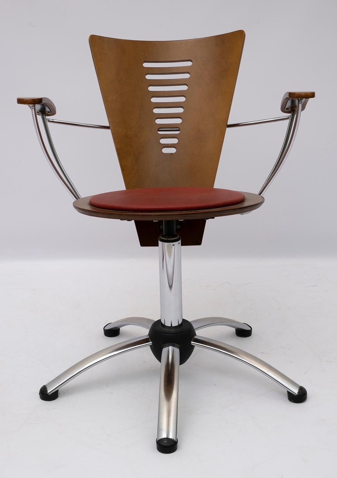 Four postmodern style swivel chairs in curved plywood and chromed metal, covered in eco-leather.