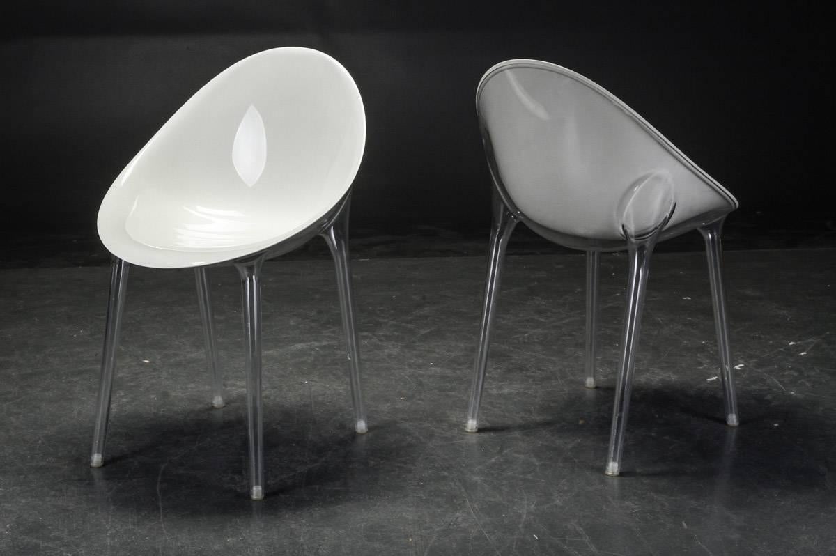 Set of four midcentury / Postmodern plastic shell chairs by British Furniture Manufacturer. Inside shell of white translucent plastic, outer shell and leg of transparent plastic. Extremely lightweight.