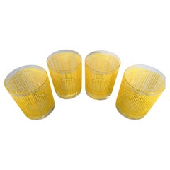 Quatre rares verres Georges Briard à motif de roches en jaune