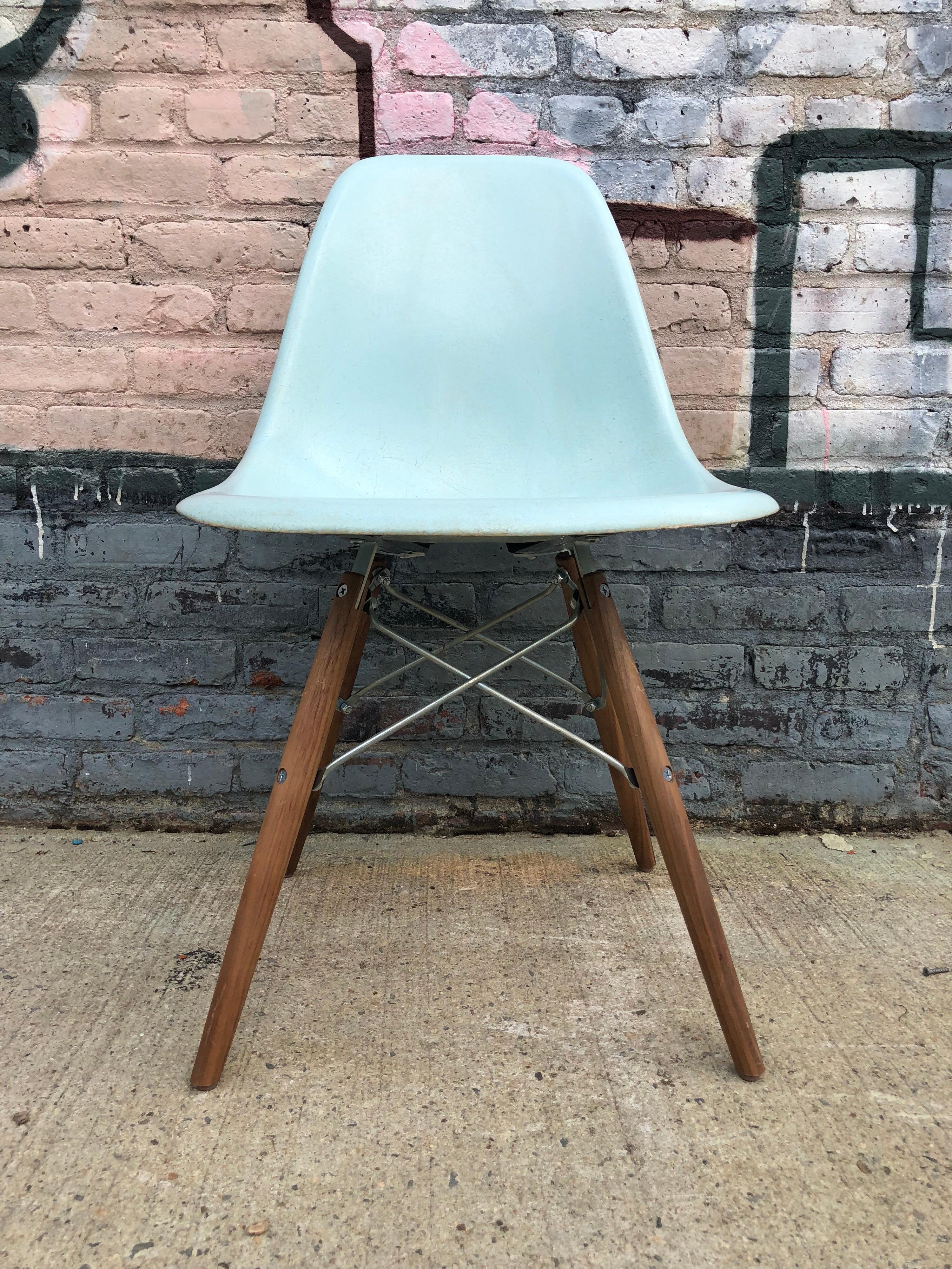 Four rare Herman Miller Eames dining chairs in Robin’s egg blue.