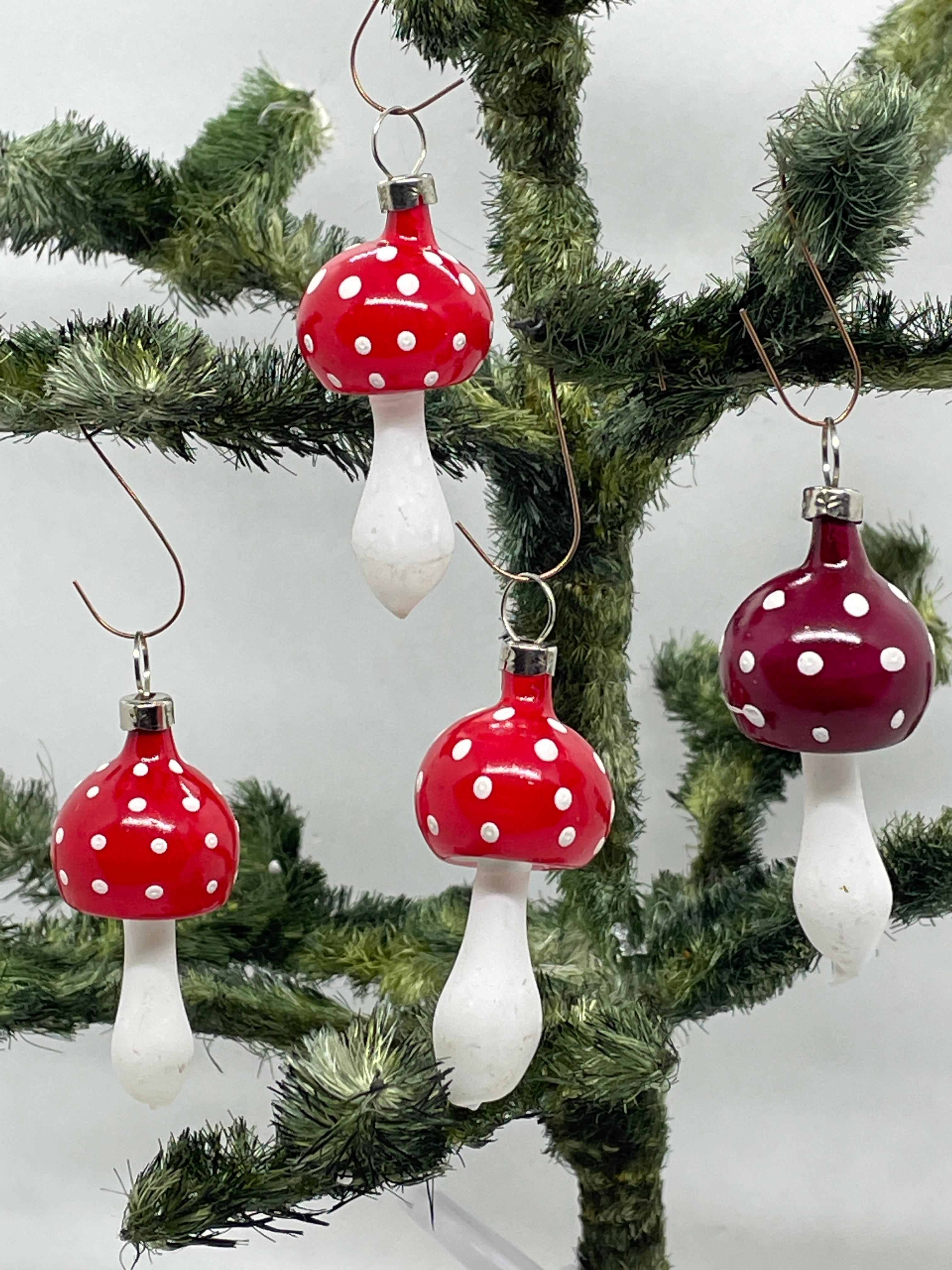 A rare christmas ornament set of four mushrooms. Each is made from thin mouth blown glass, this would be a great antique addition for your christmas or feather tree.
 