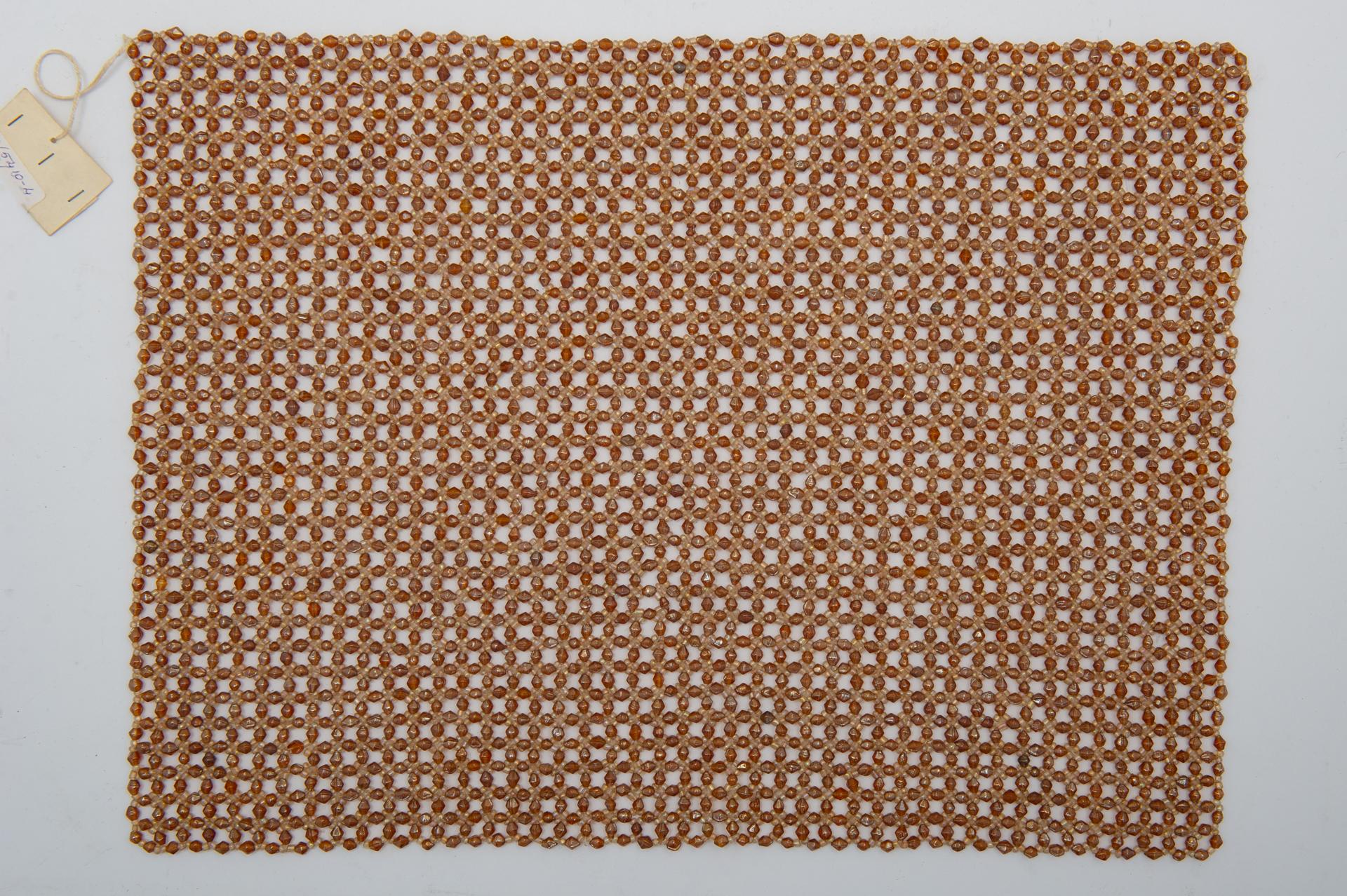 Four rectangles of mauve beads, may be designed as placemats; but I think they can be turned into a beautiful lamp. 
What do You thing ? It's an idea.