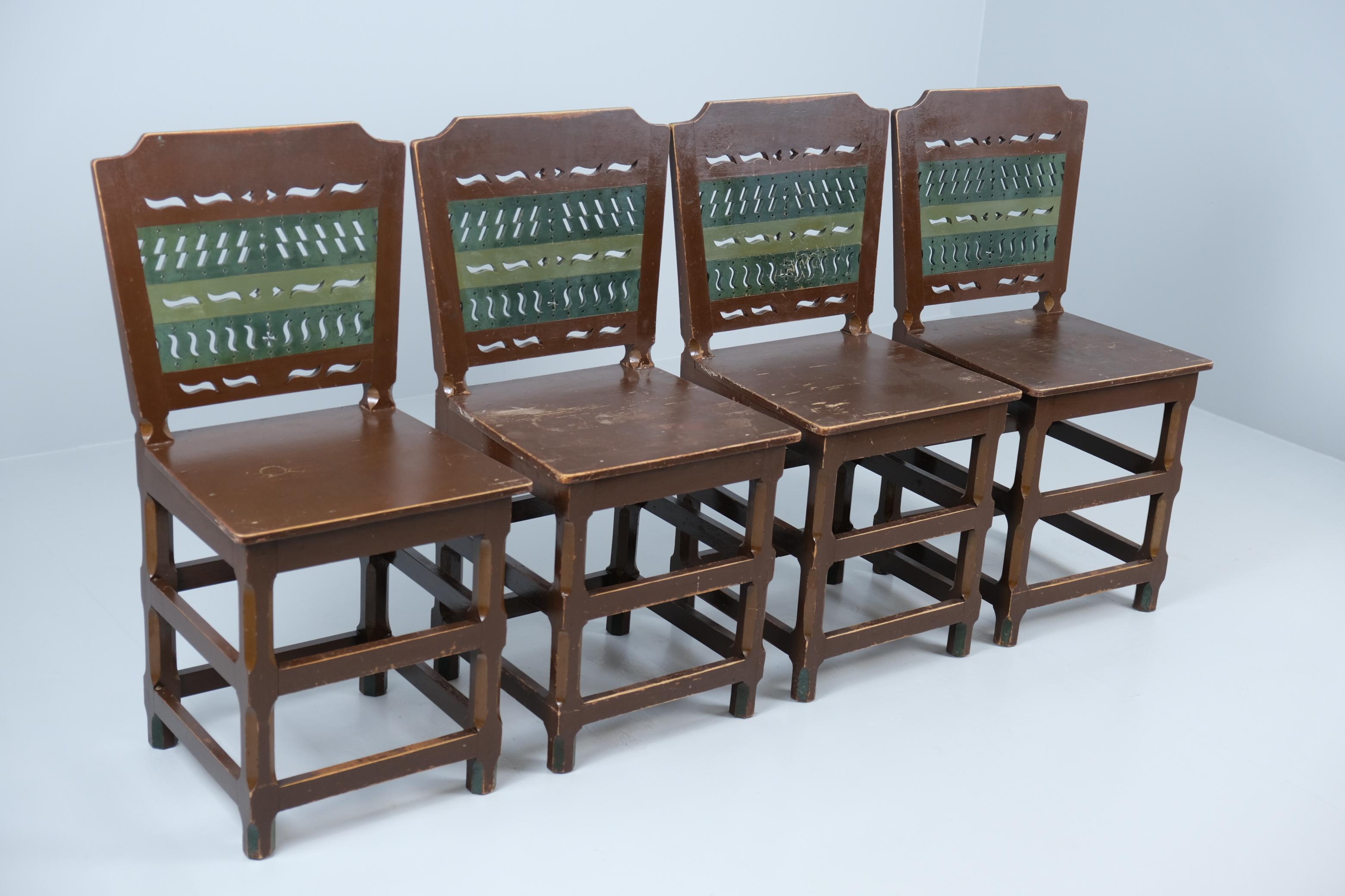 A beautiful set of 4 hand made and painted folk chairs from the 1950s. The chairs are made with the traditional Finnish folk renaissance style used in the 1700-1800s and are coloured with earthly tones of greens and browns. The chairs are made of