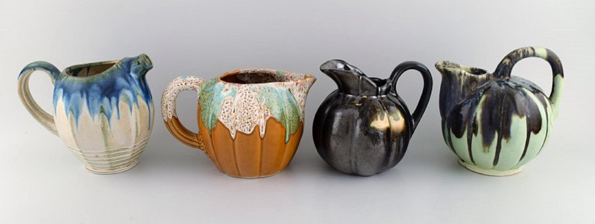 Four retro jugs in glazed ceramics. Beautiful glazes and shapes, Belgium, 1960s-1970s.
Largest measures: 18.5 x 17 cm.
In excellent condition.
Stamped.