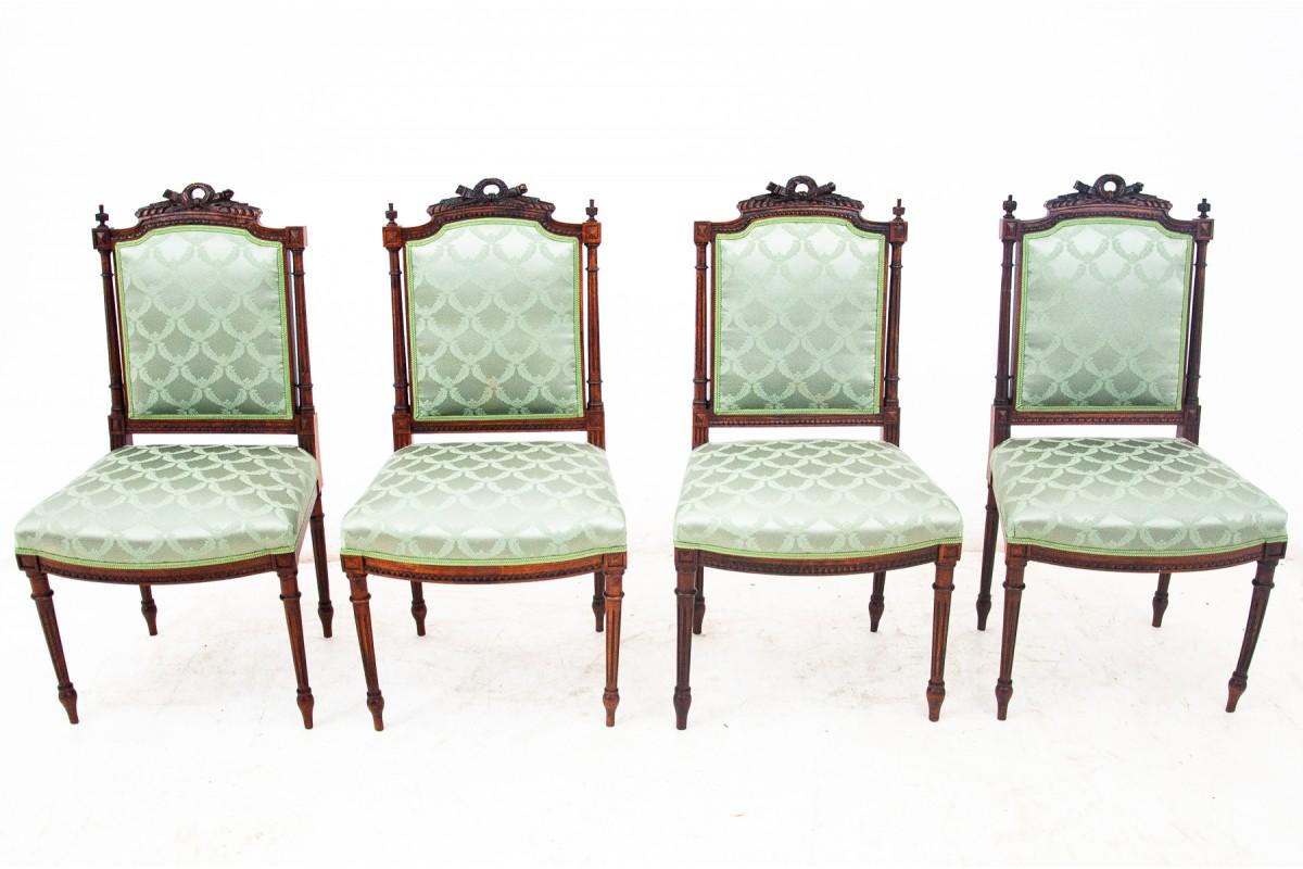 A set of four rococo style chairs, from France. The chairs were renovated and the upholstery was replaced with a new, aquamarine fabric. Decorated ends of the backrest and chair legs, referring to the Rococo style.

Dimensions:

Height: 96cm

Seat