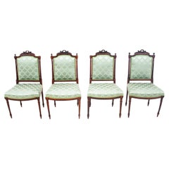Used Four Rococo style chairs, France.