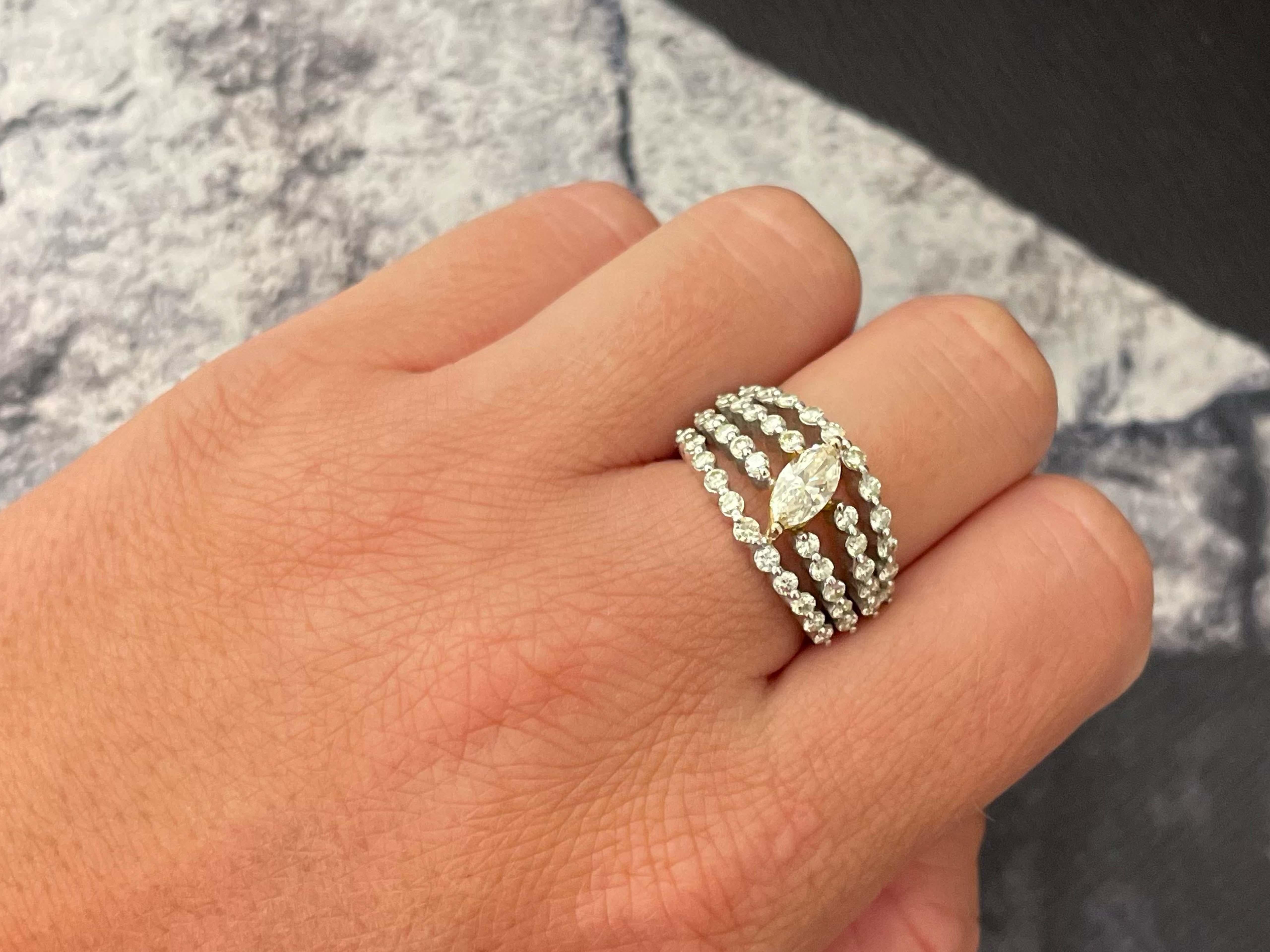 Item Specifications:

Metal: 18k White Gold

Style: Statement Ring

Ring Size: 6.5 (resizing available for a fee)

Total Weight: 9.9 Grams

Diamond Count: 43

Diamond Carat Weight: 0.50 (center) + 1.26 additional


Diamond Clarity: VS


Diamond
