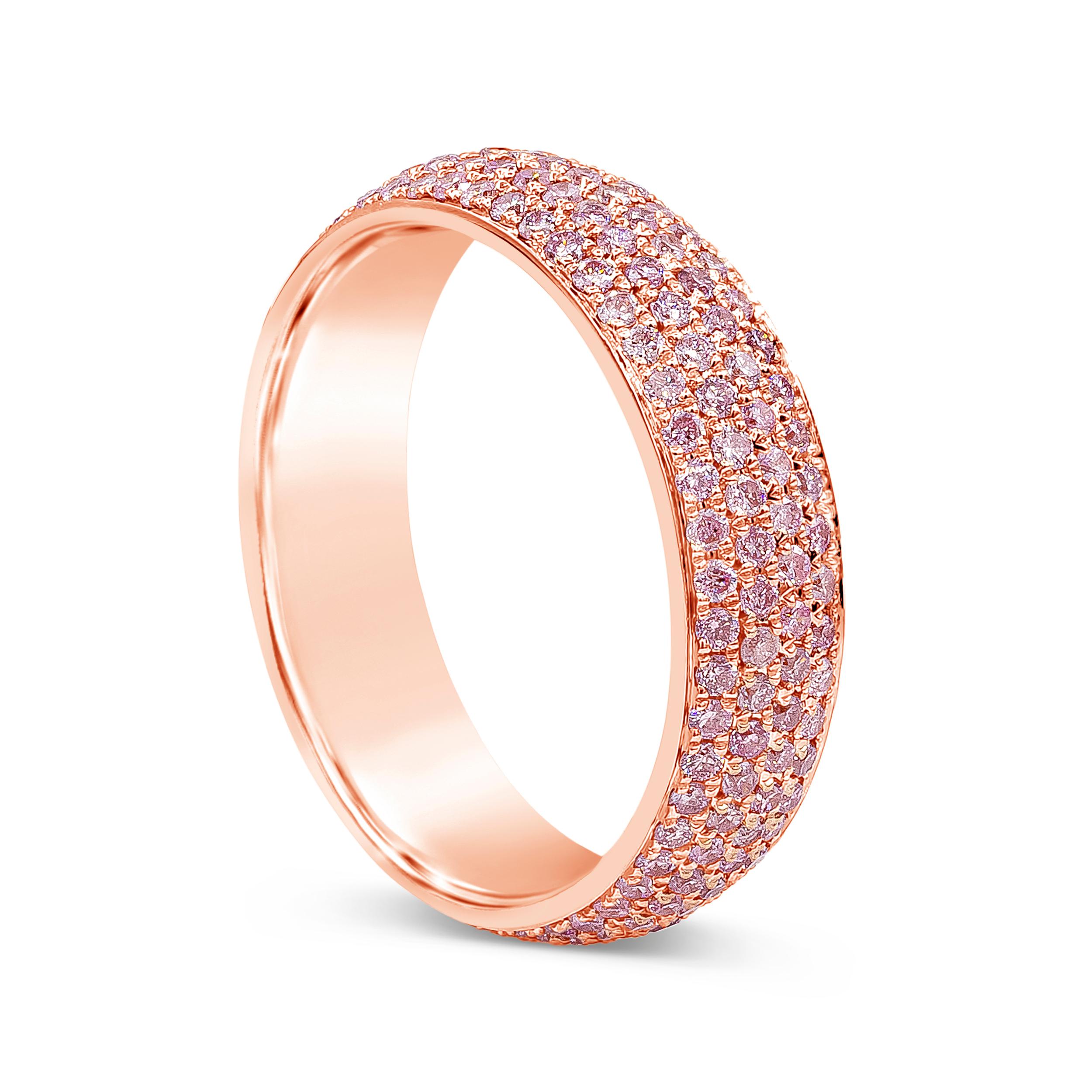 A chic and color-rich wedding band showcasing four rows of 200 round brilliant pink diamonds, micro-pave set in 18k rose gold. Diamonds weigh 1.21 carats total. The band is 5mm in width and Finely made in 18k rose gold. Size 6.25 US resizable upon