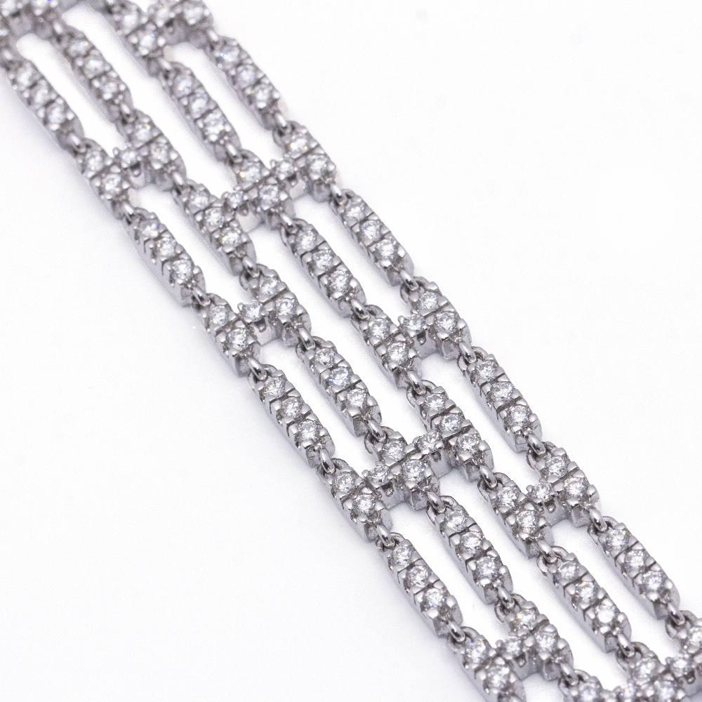 4-Strand RIVIERE Bracelet in Gold and Diamonds for women : 210x Brilliant Cut Diamonds weighing 5,45cts. in G/Vs quality : 18kt White Gold : 42,18 grams : Solid : 17,5 cm long and 1,5cm wide : Drawer clasp with 2x safety lugs : This item is in a