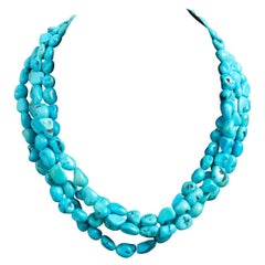 Collier turquoise à quatre rangées, fermoir en métal estampillé 7350, Italie, vers 1990.