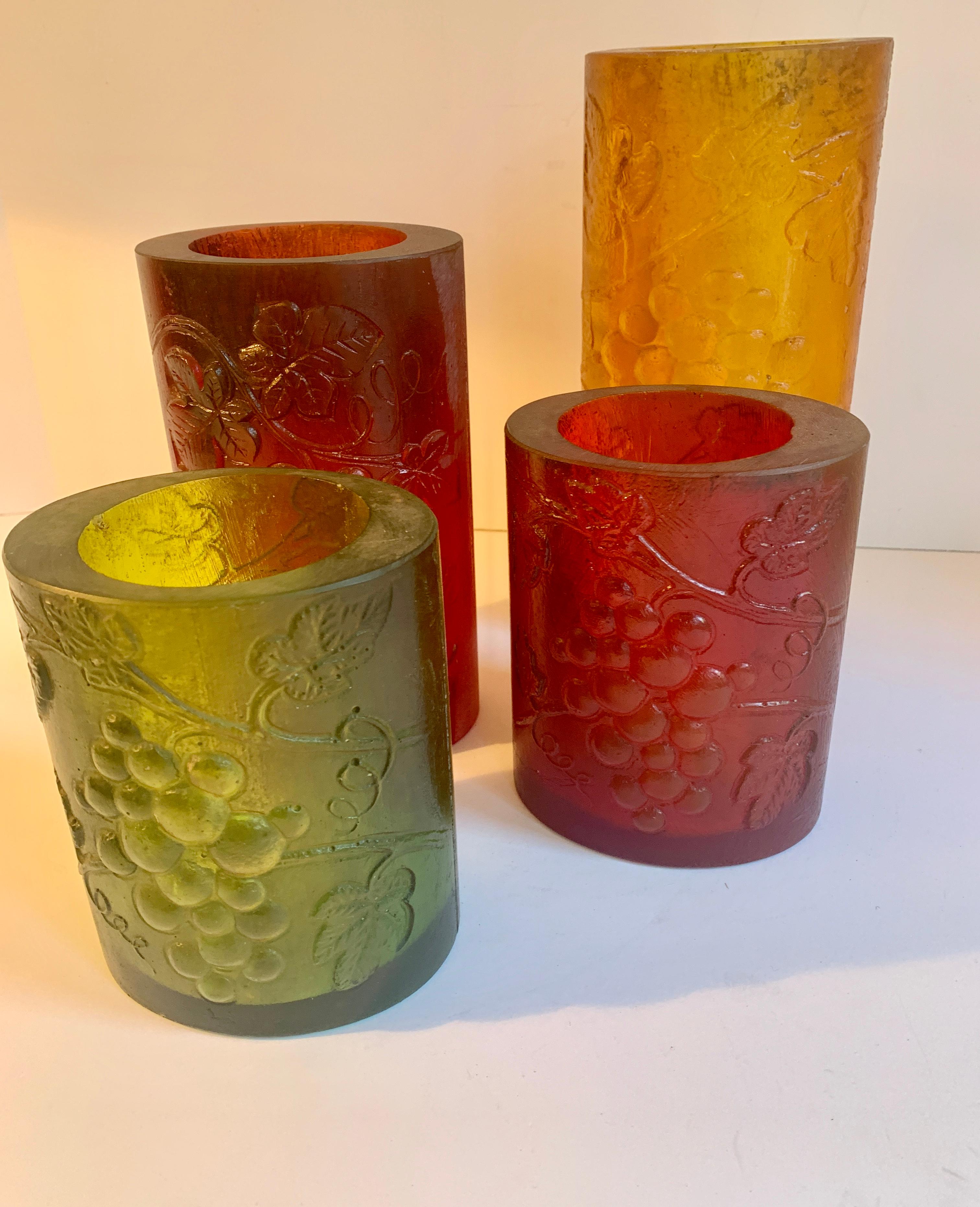 Four resin Sascha Brastoff candleholders with grape motif - perfect or any room, or outdoor table
all are 4.5