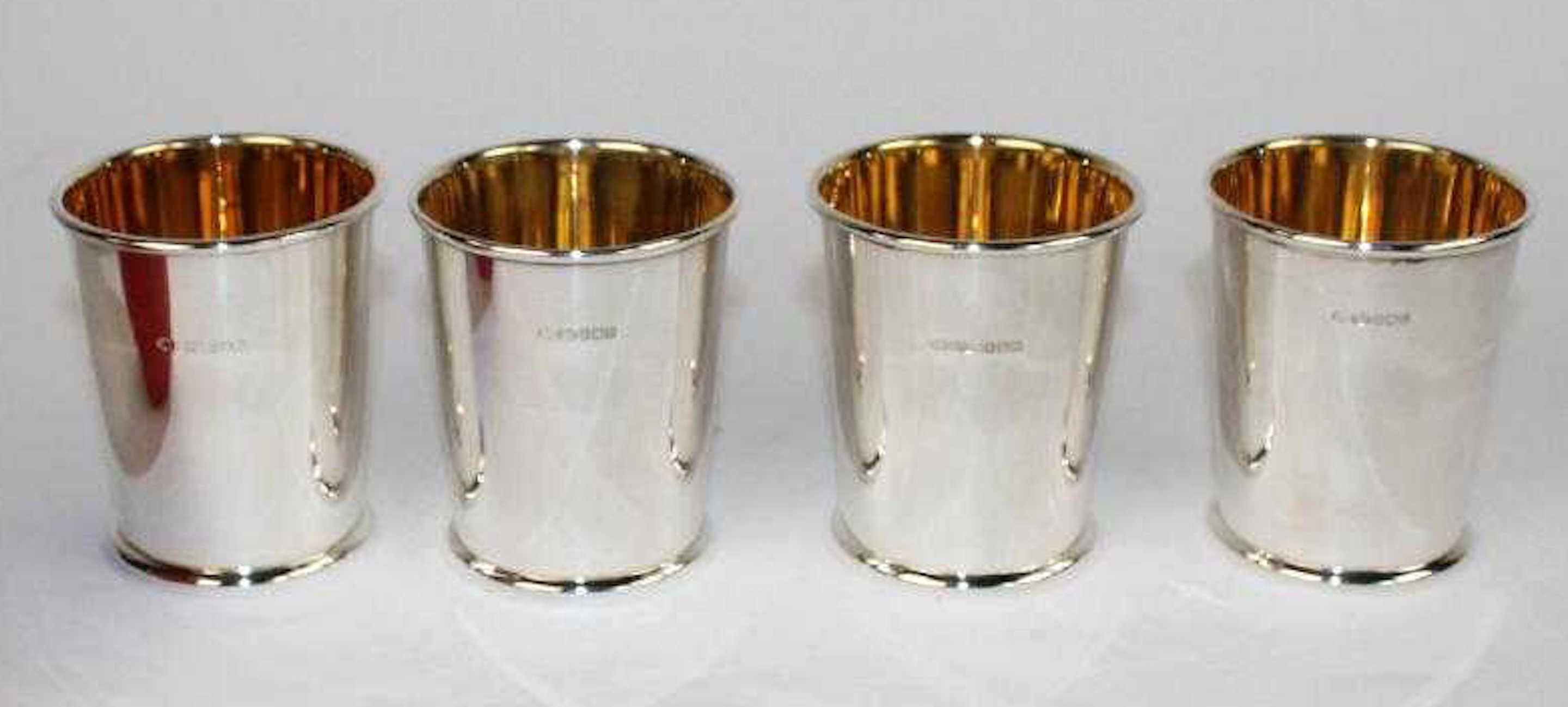 Four Scottish cast sterling mint Julep Cups, Edinburgh, 2005, retailed by Links, London. Each one of fine calibre with gold washed interior, with cast horseshoe at bottom.
Measures: Four 3