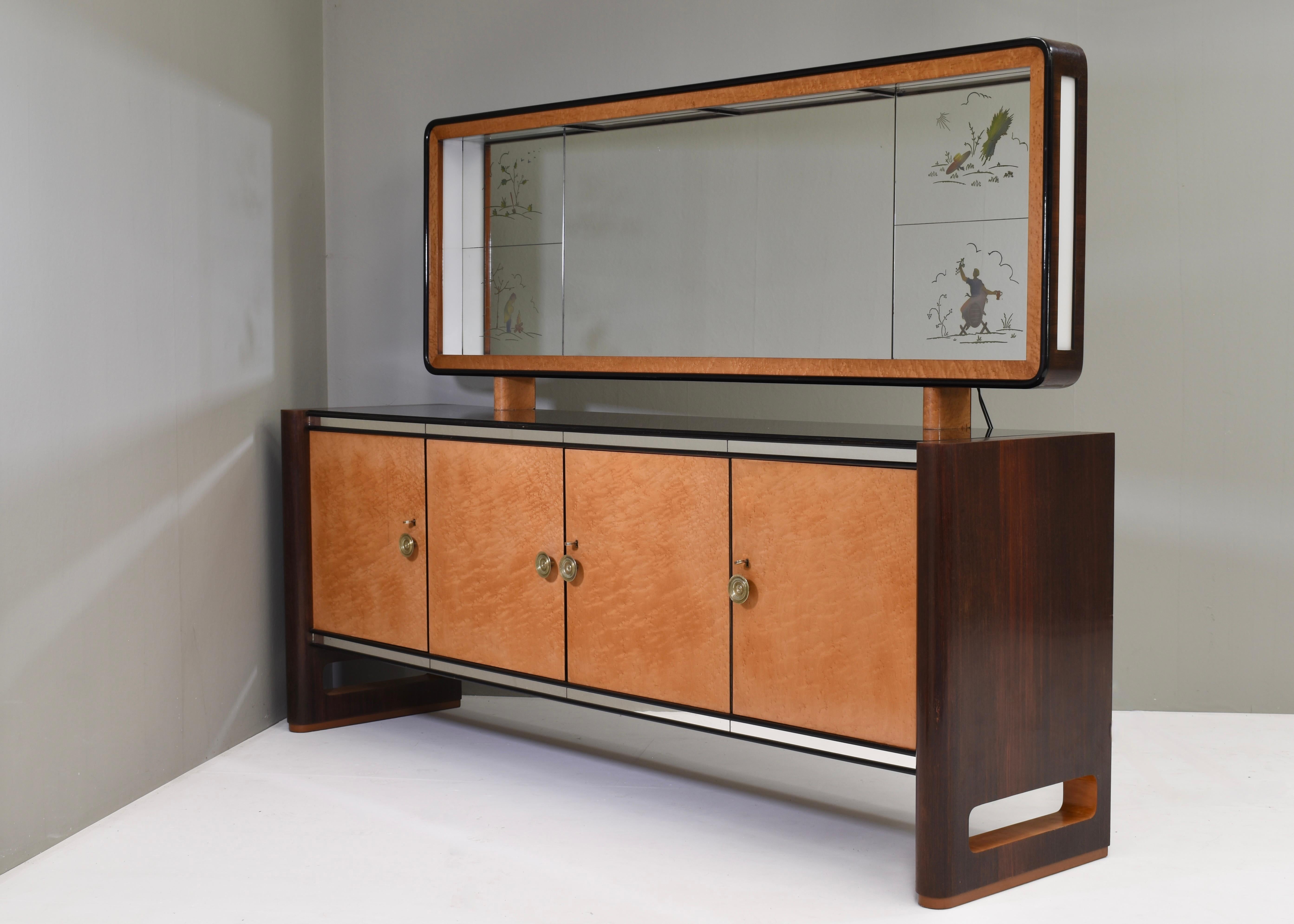Impressive 'Four Seasons' Art-Deco sideboard with illuminated mirror by or in the style of father and son Gaetano and Osvaldo Borsani for La permanente Mobili Cantù (Palazzi Dell'Arte) - 1930's. Label inside.

The mirror has four carved out images