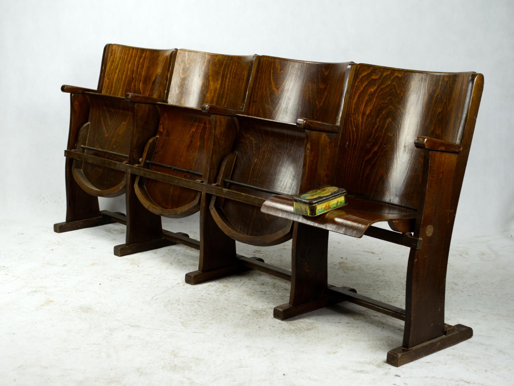 Four-seat cinema bench produced by TON in Harmanec, Czechoslovakia in circa 1950. Item originally used in a village cinema, made completely of wood and bended wood features typical for TON. Seats fold upwards. Very good, original condition with