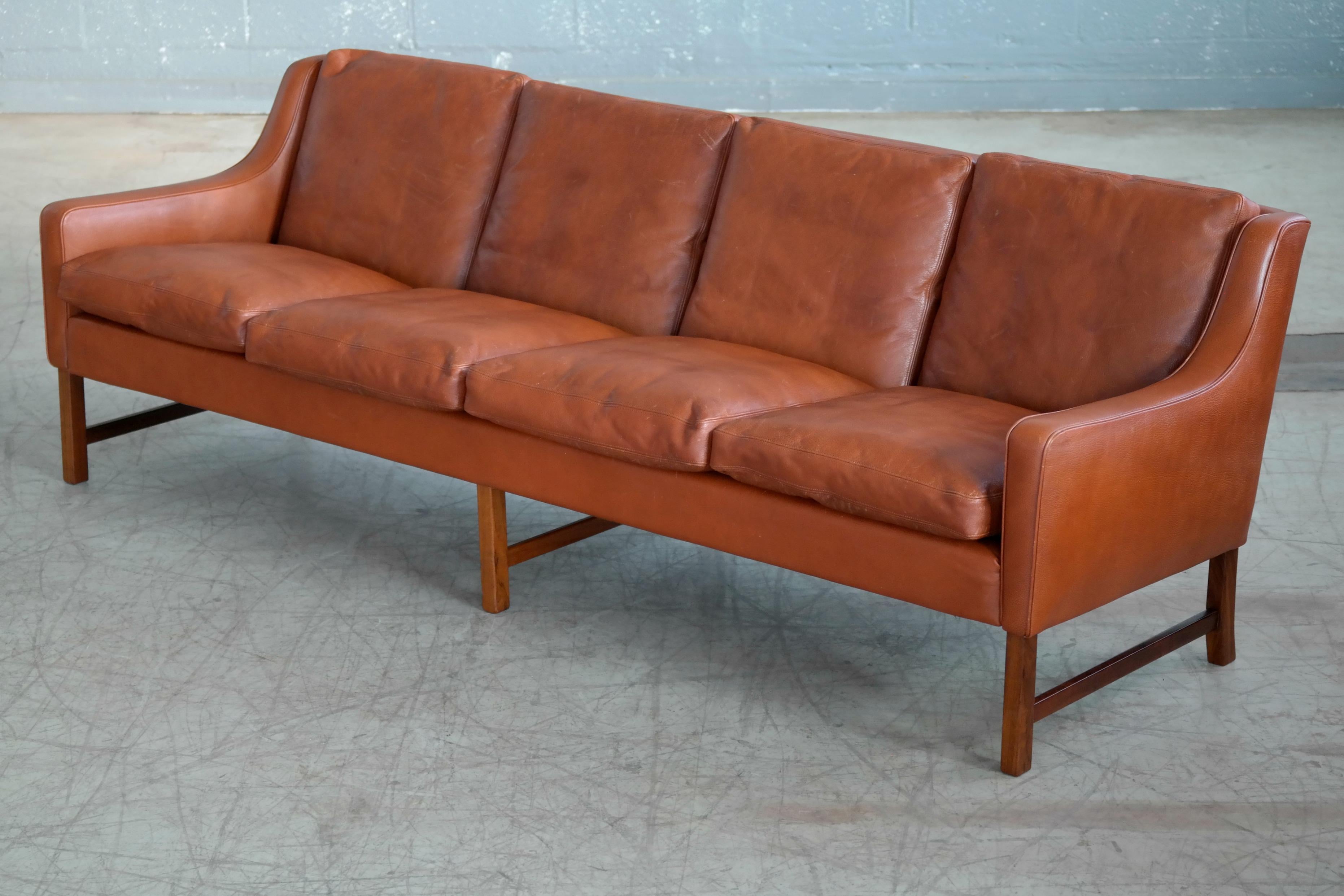 This very elegant and generously sized four-seat sofa was designed
by one of Norway's most iconic Designers, Fredrik A. Kayser for Vatne sometime in the late 1960s as model 965. We estimate the manufacture to have been in the early 1970s. It's rare