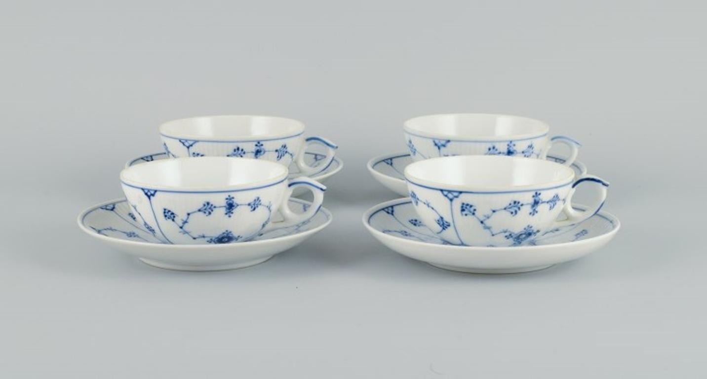 Four sets of Royal Copenhagen Blue Fluted Plain tea cups and saucers in hand-painted porcelain.
Model 1/76 
Approx. 1920s/30s.
In excellent condition.
Marked.
Second factory quality.
Measurements: D 9.5 cm. (without handle) x H 4.5 cm.