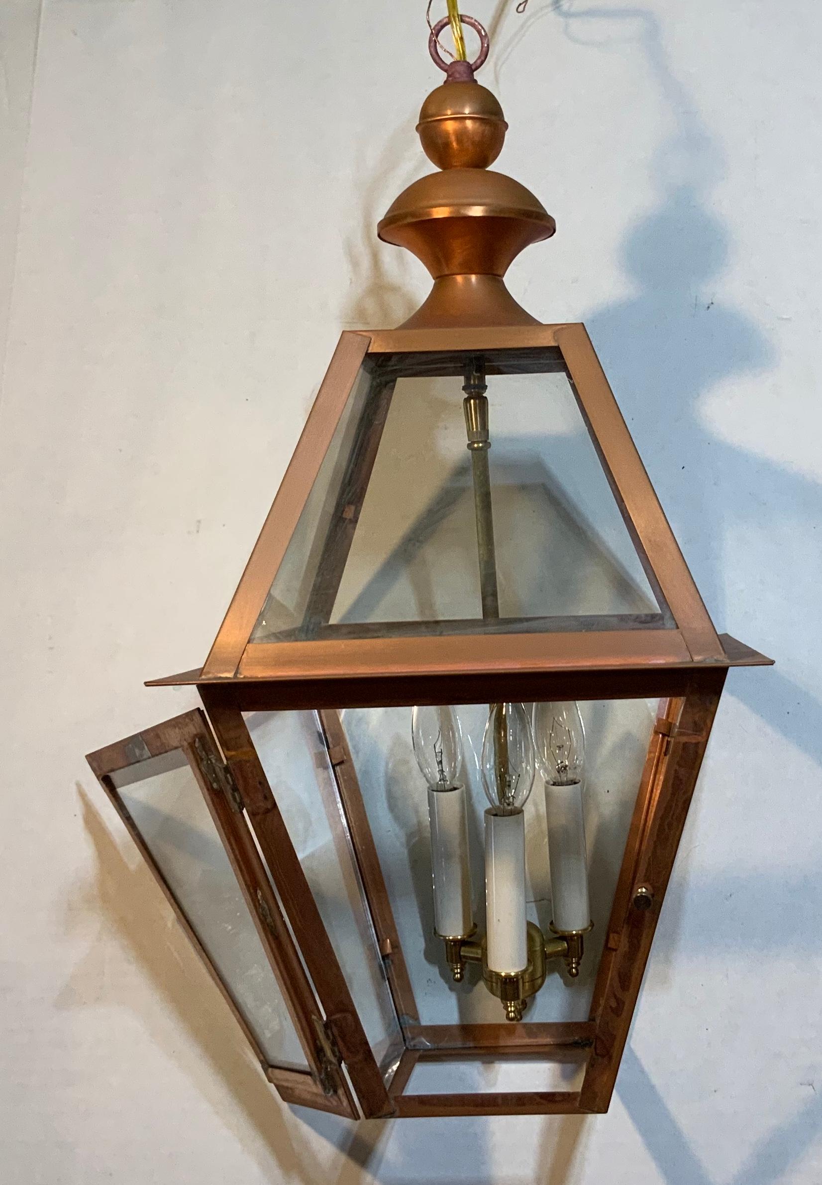 Quality handmade of copper lantern with three 60 watt lights.
Electrified and ready to light.
Made in the US and UL approved .
Could be used in wet location and inside.
Chain and canopy included.