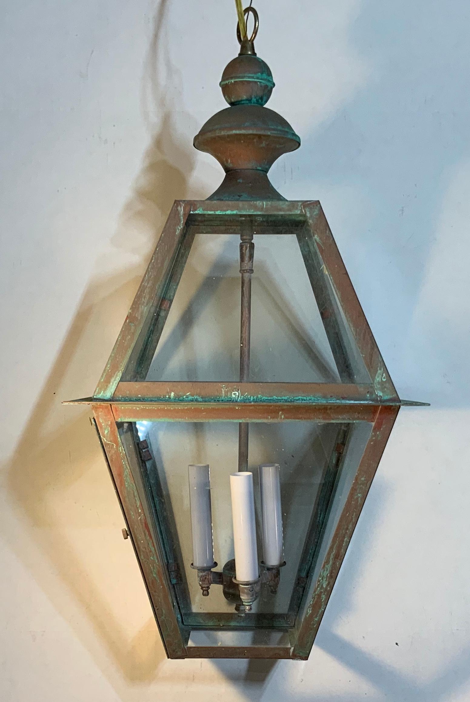 Quality handmade of copper lantern with three 60 watt lights.
Electrified and ready to light. Beautiful oxidization patina.
Made in the US and UL approved.
Could be used in wet location and inside.
Chain and canopy included.