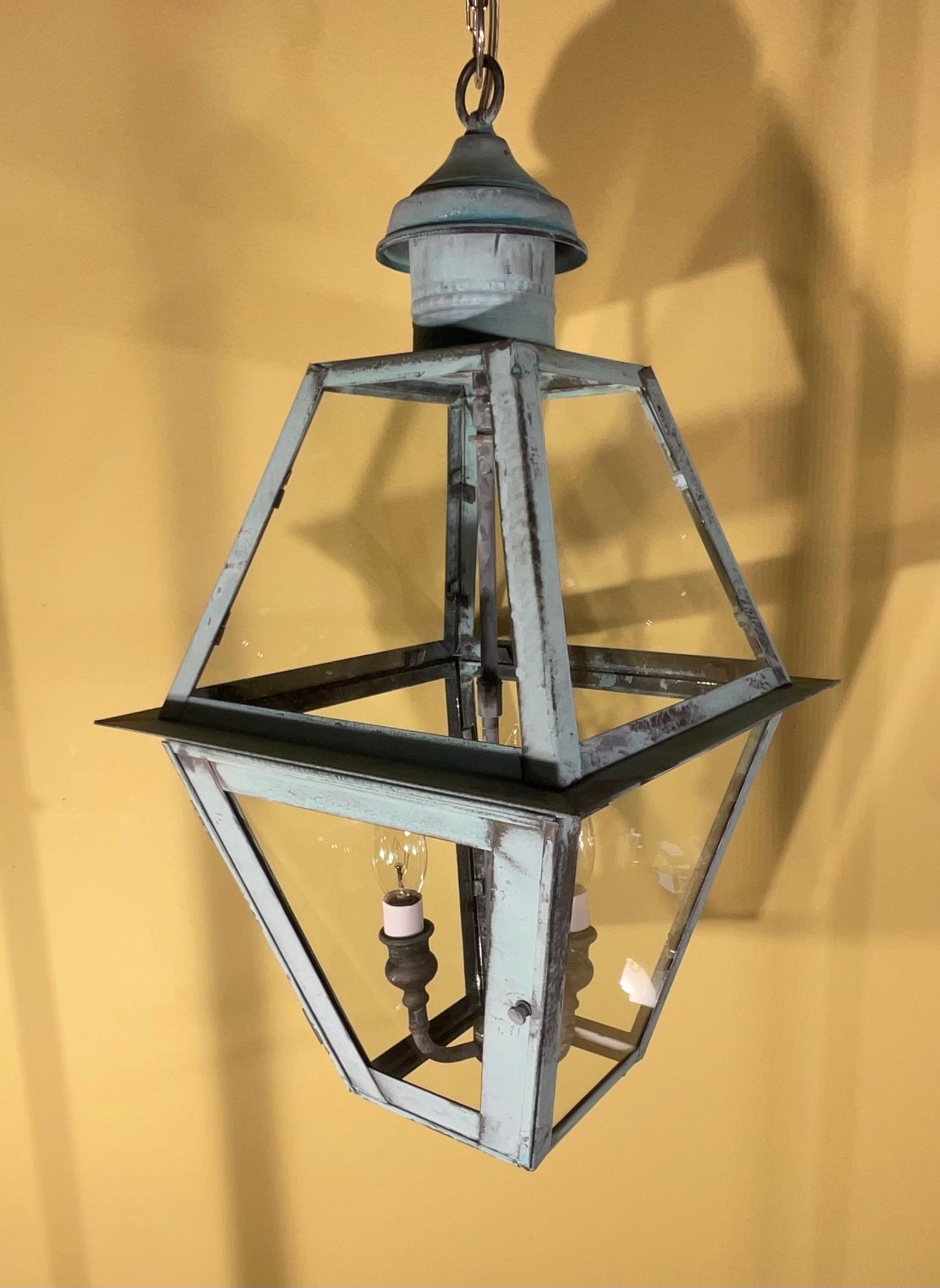 Quality handmade of solid copper lantern with three 40 watt lights.
Electrified and ready to light. Beautiful oxidization patina.
Made in the US 
Could be used in wet location and indoor.