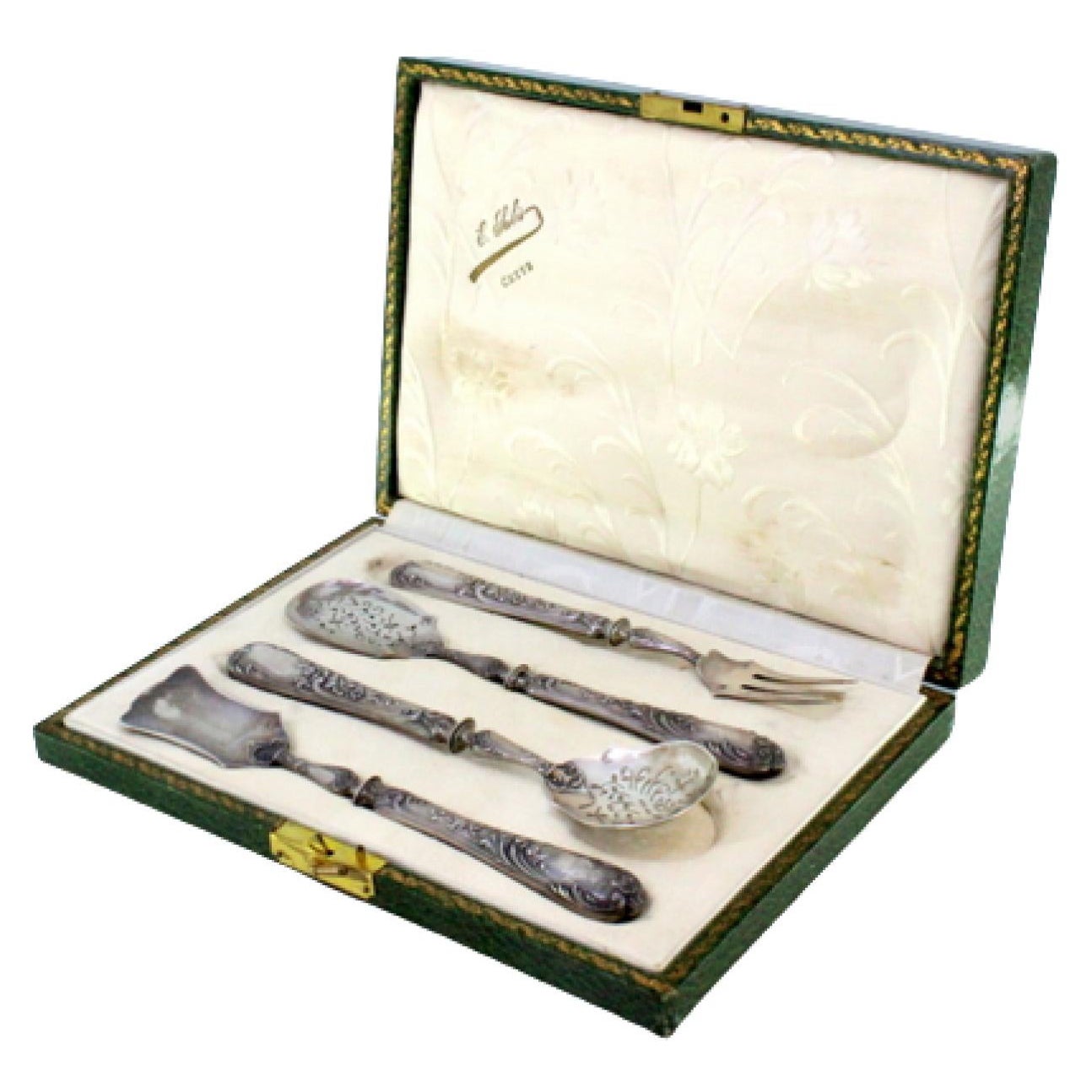 Four silver dessert pieces with cut-out shells and raised floral handles, cased