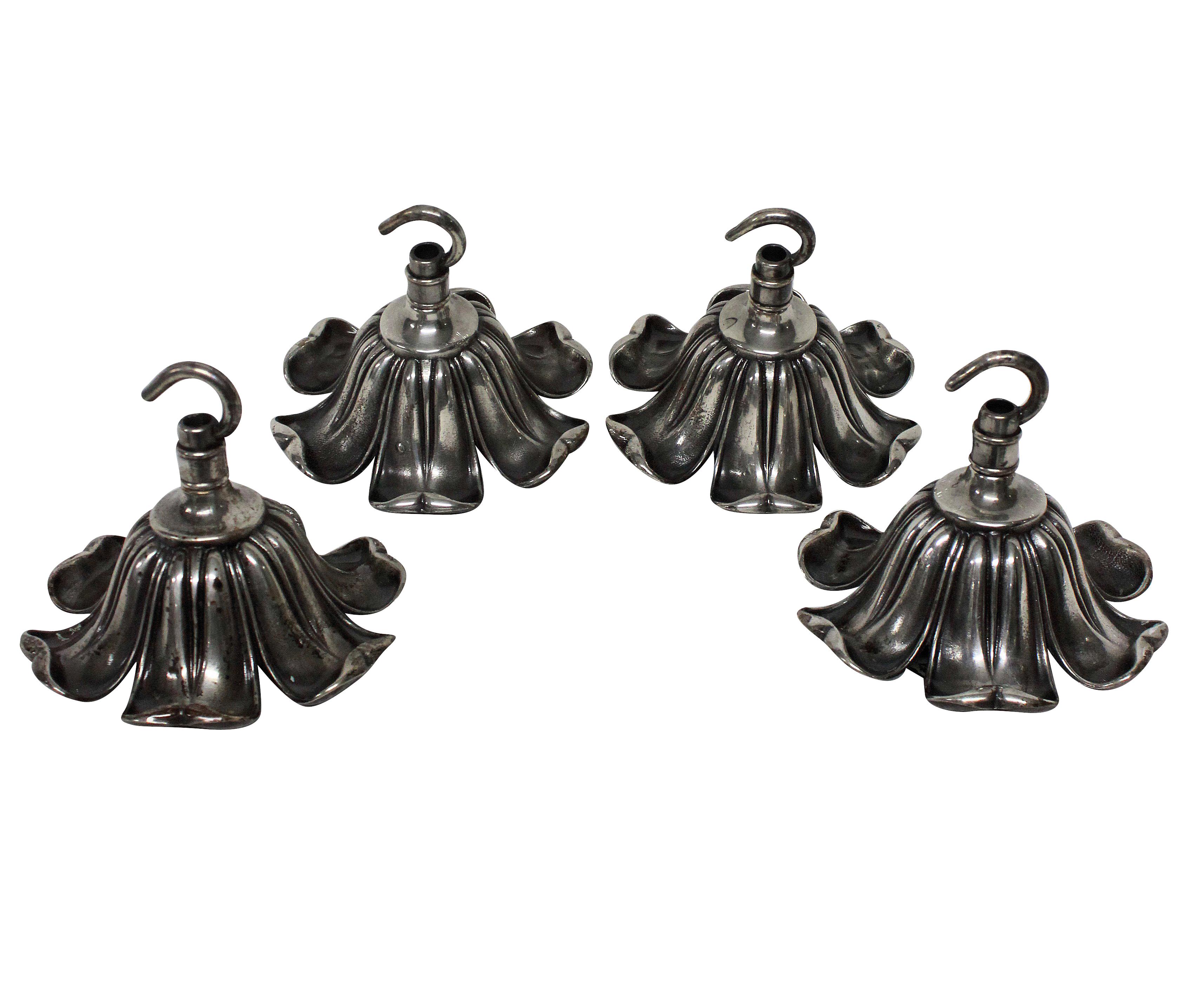 A set of four matching silver plated chandelier ceiling hooks.
