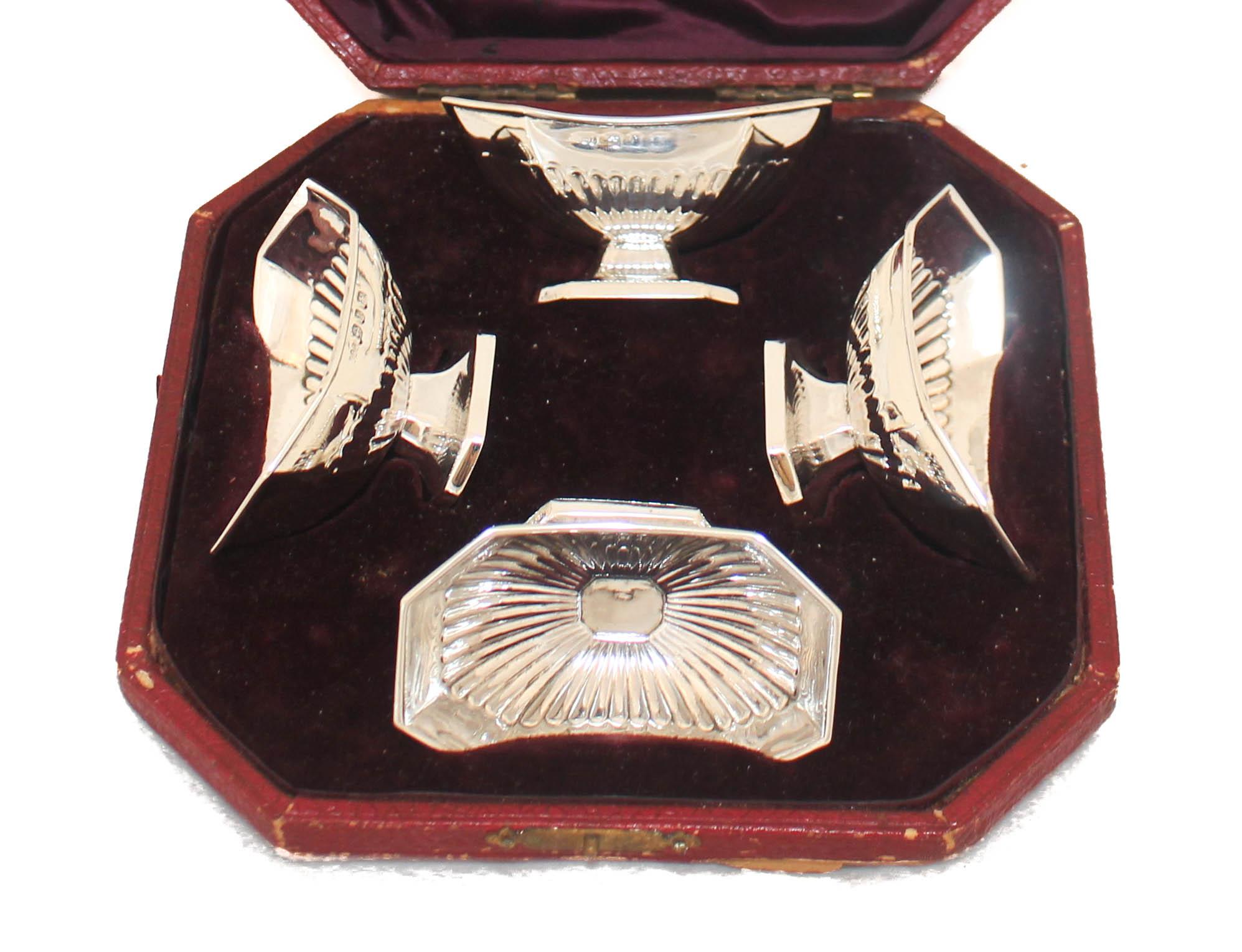 We are delighted to offer you this set of four sterling silver salt cellars from England, hallmarked 1878. We have the original case that they came in; they were sold at Alexander Brothers Limited in Liverpool, England. Each salt cellar fits into