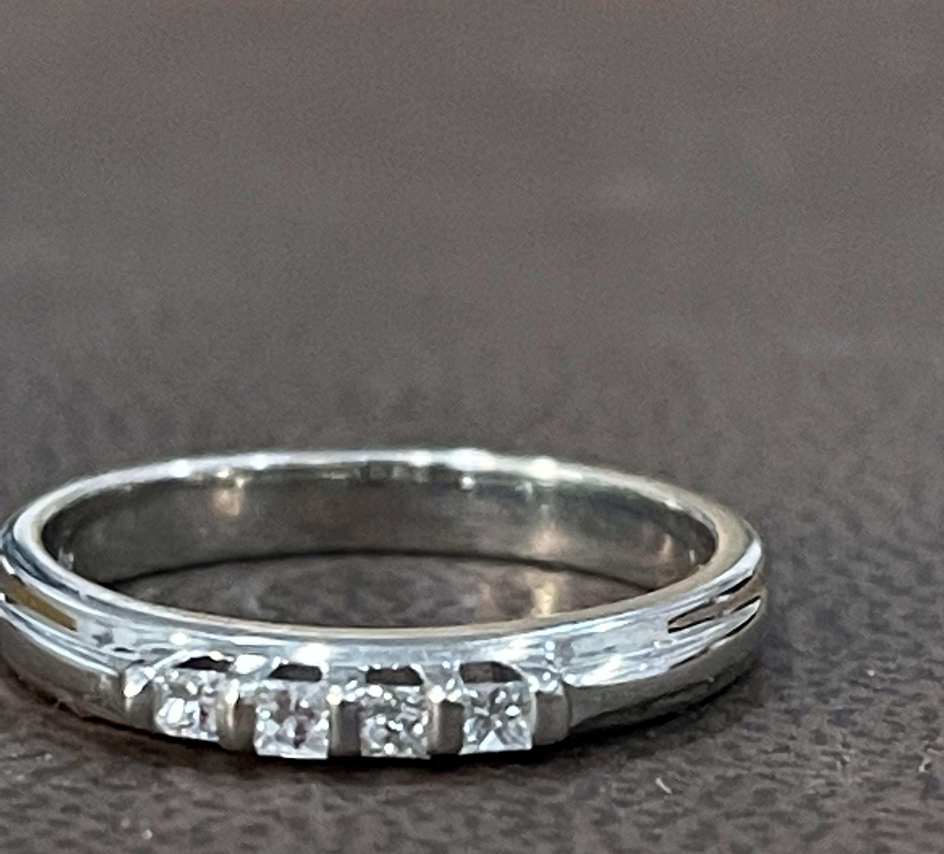 Four Stone Diamond  Traditional  Ring/Band 14 Karat White Gold
Four  Princess cut diamonds  next to each other  to make a half band 
Diamond SI  quality and H/I Color
This is a Engagement band  from our affordable wedding collection.
 band 
These  