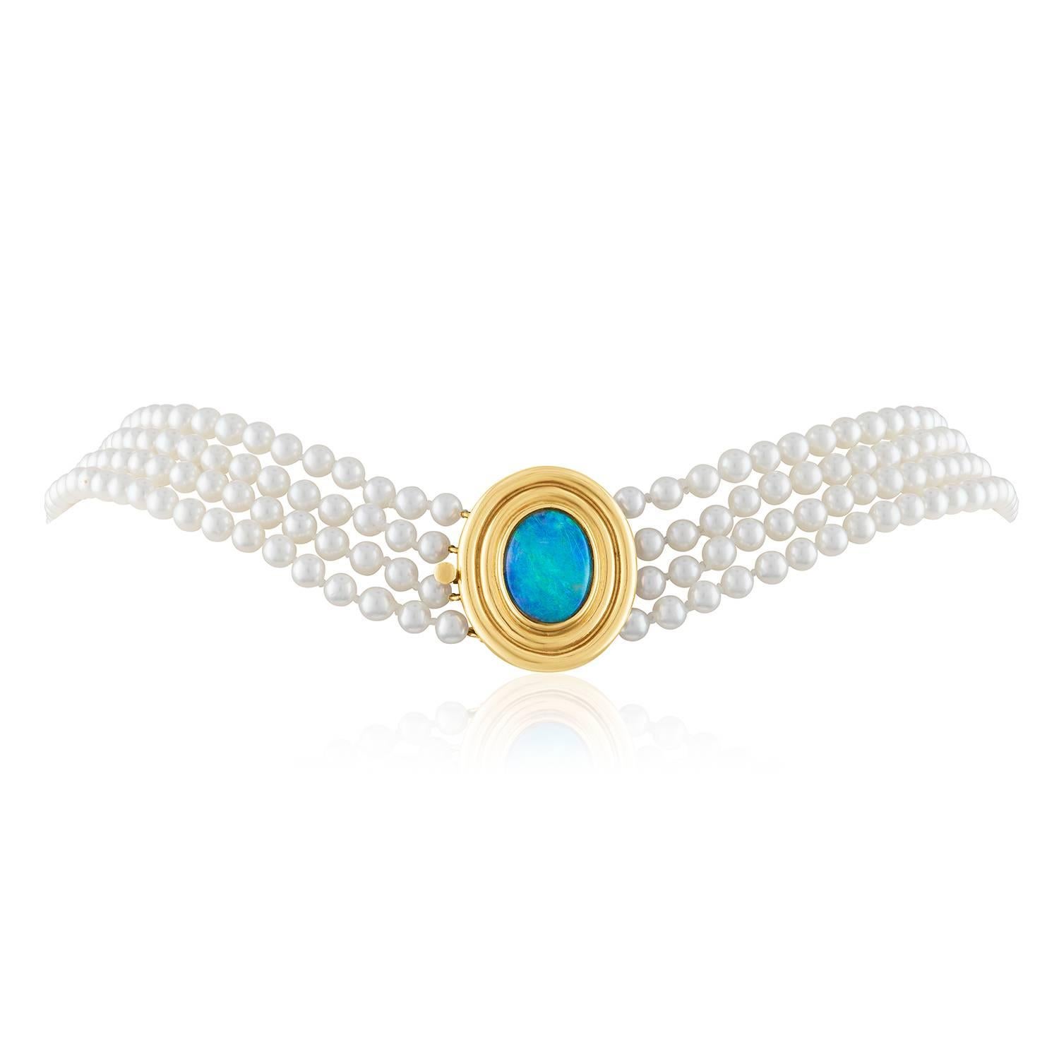 Very Classic 4 Strand Pearl Necklace
The clasp is 14K Yellow Gold
The pearls measure 4.0mm
The pearls are Cultured Akoya Pearls.
The clasp has an Australian Opal
The necklace is 16.75