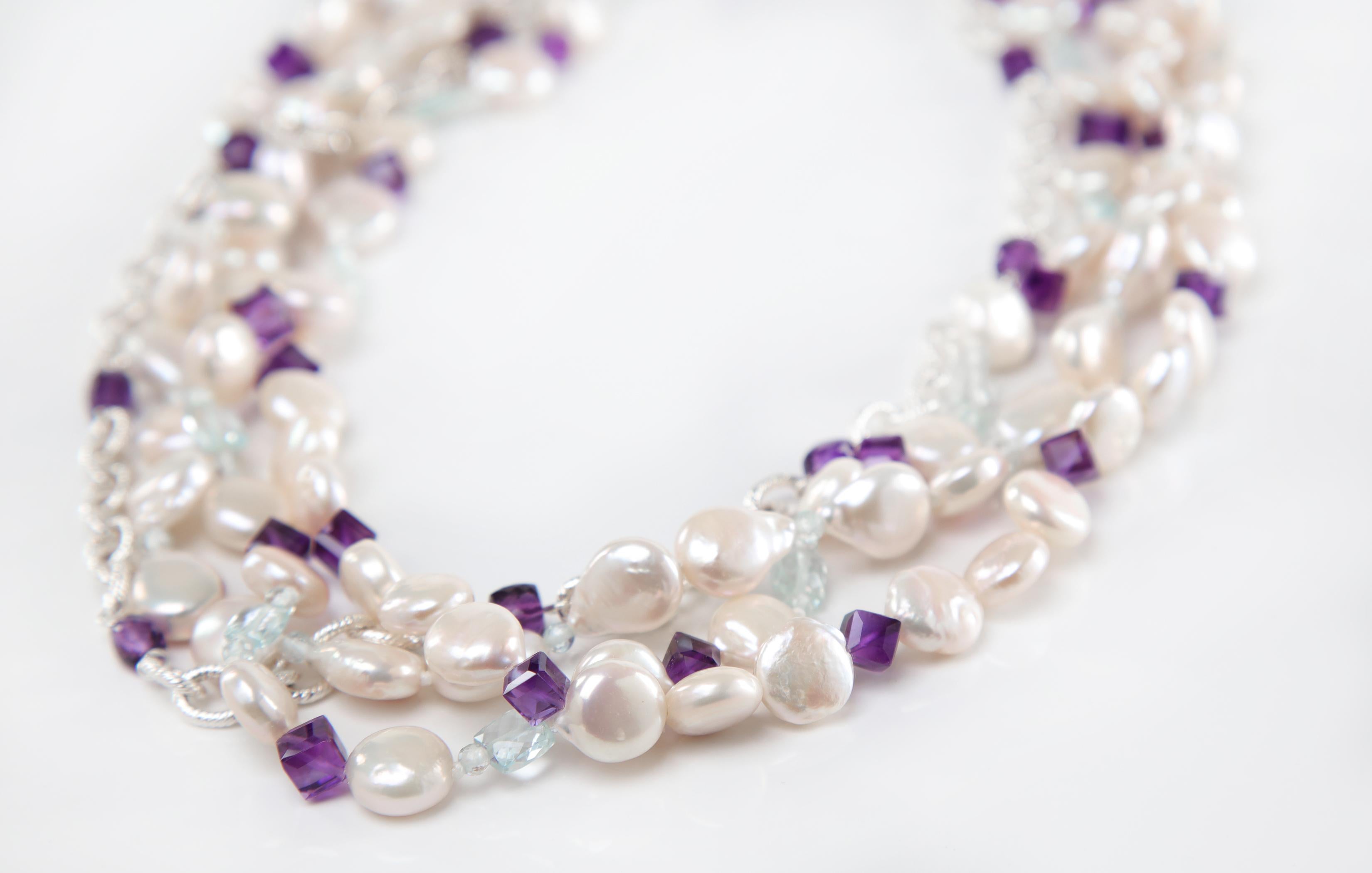 This freshwater pearl, amethyst, aquamarine, and silver necklace feels like  
