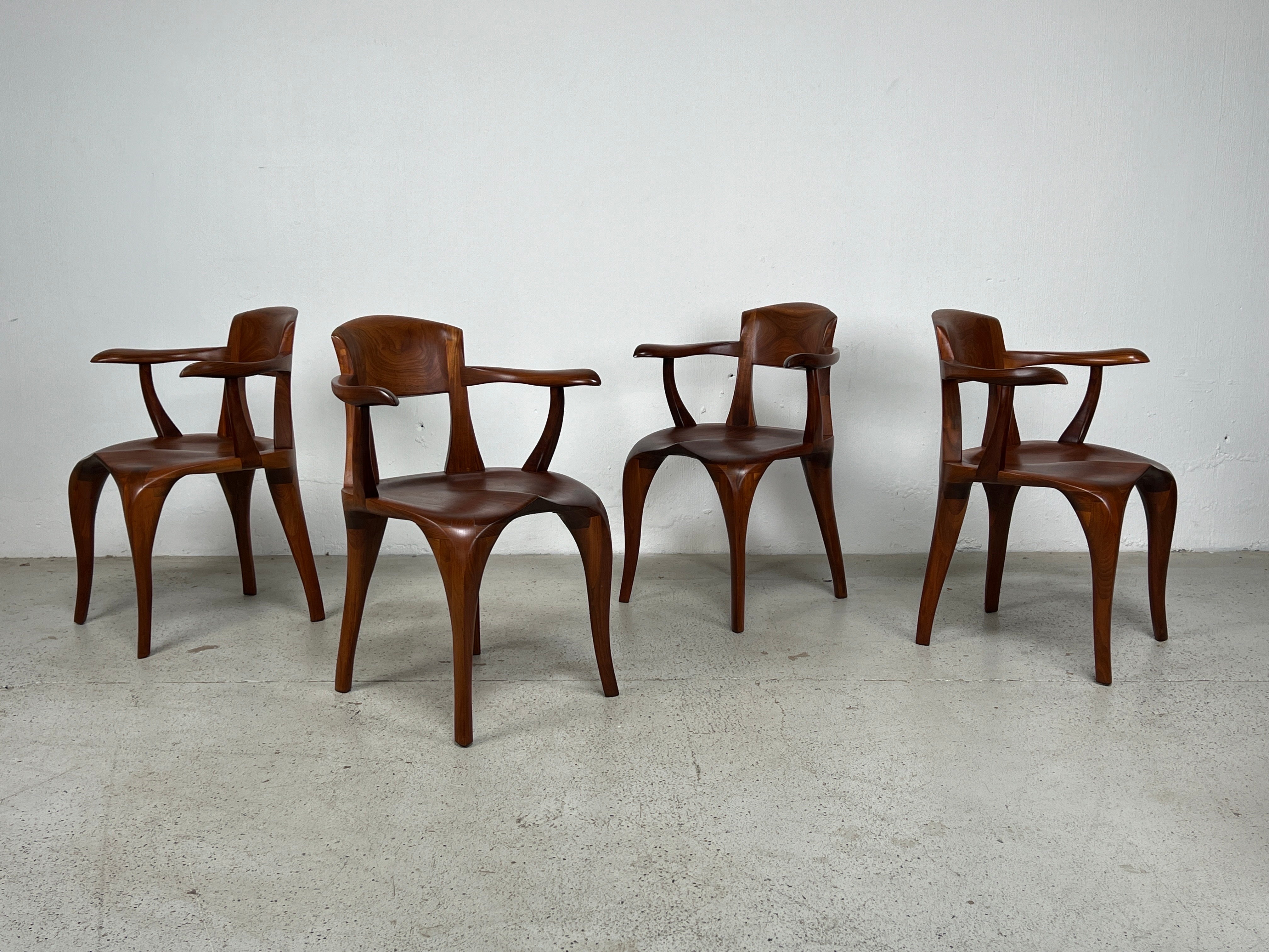 A set of four beautifully crafted walnut armchairs by Victor DiNovi. 