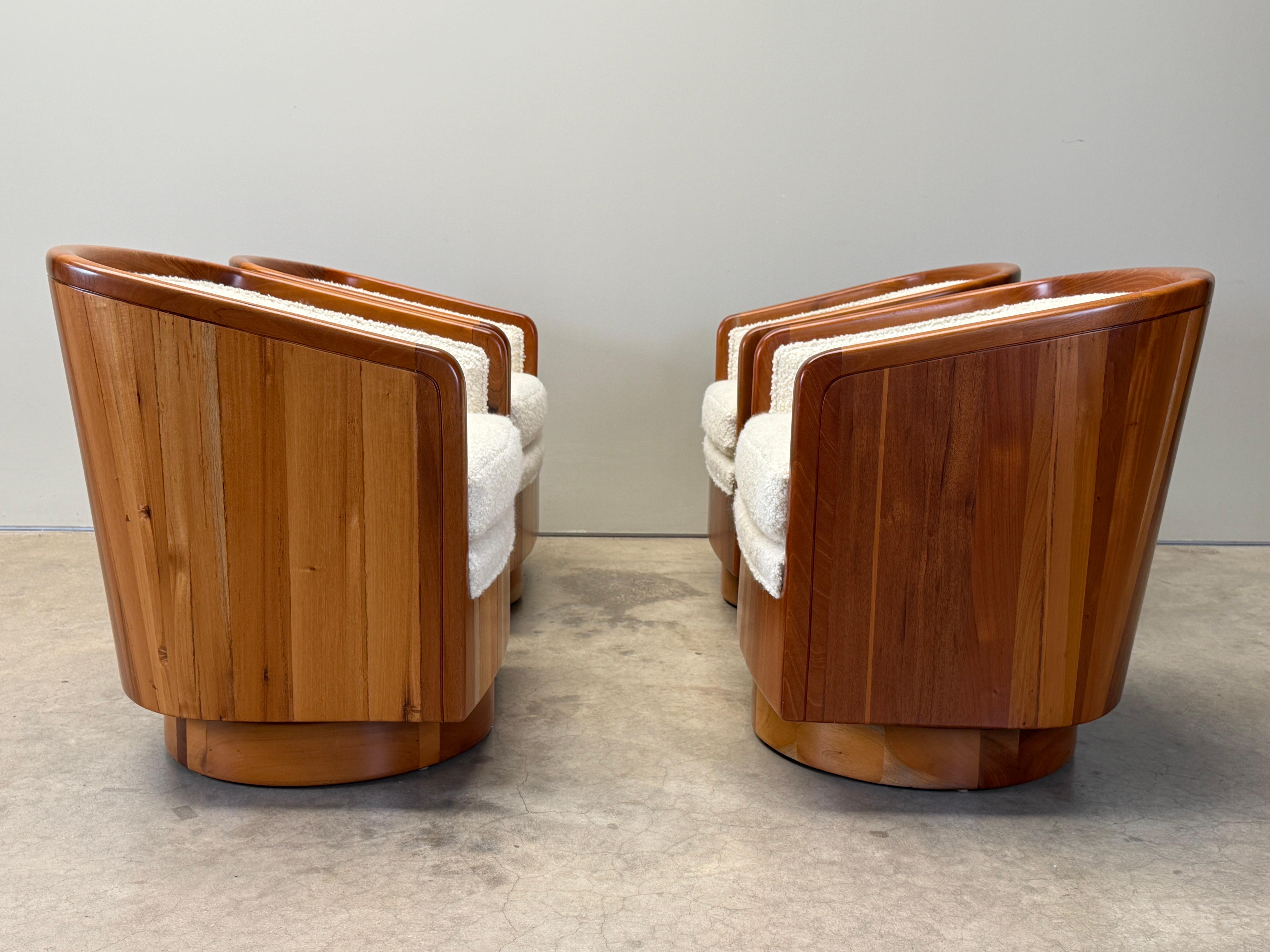 A set of four bench made solid wood studio craft swivel chairs refinished and reupholstered in Holly Hunt / Teddy / Winter white 