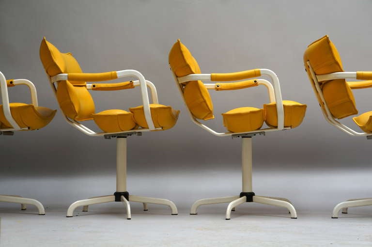 Italian Four Swivel Armchairs in Yellow Leather and White Base For Sale