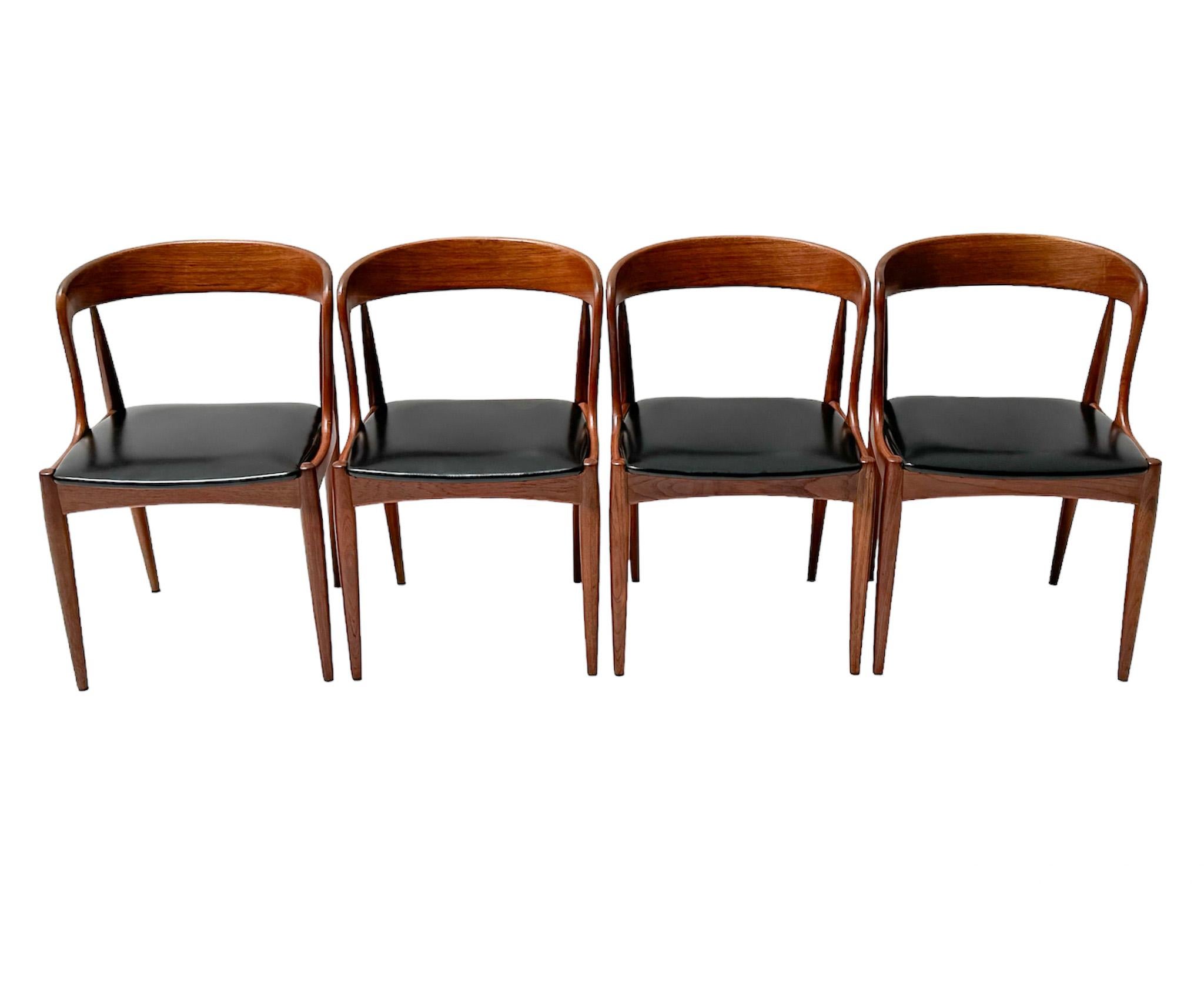 Stunning and elegant set of four Mid-Century Modern Model 16 dining chairs.
Design by Johannes Andersen for Uldum Møbelfabrik.
Striking Danish design from the 1960s.
Original solid teak frames with original black faux leather seats.
Marked with