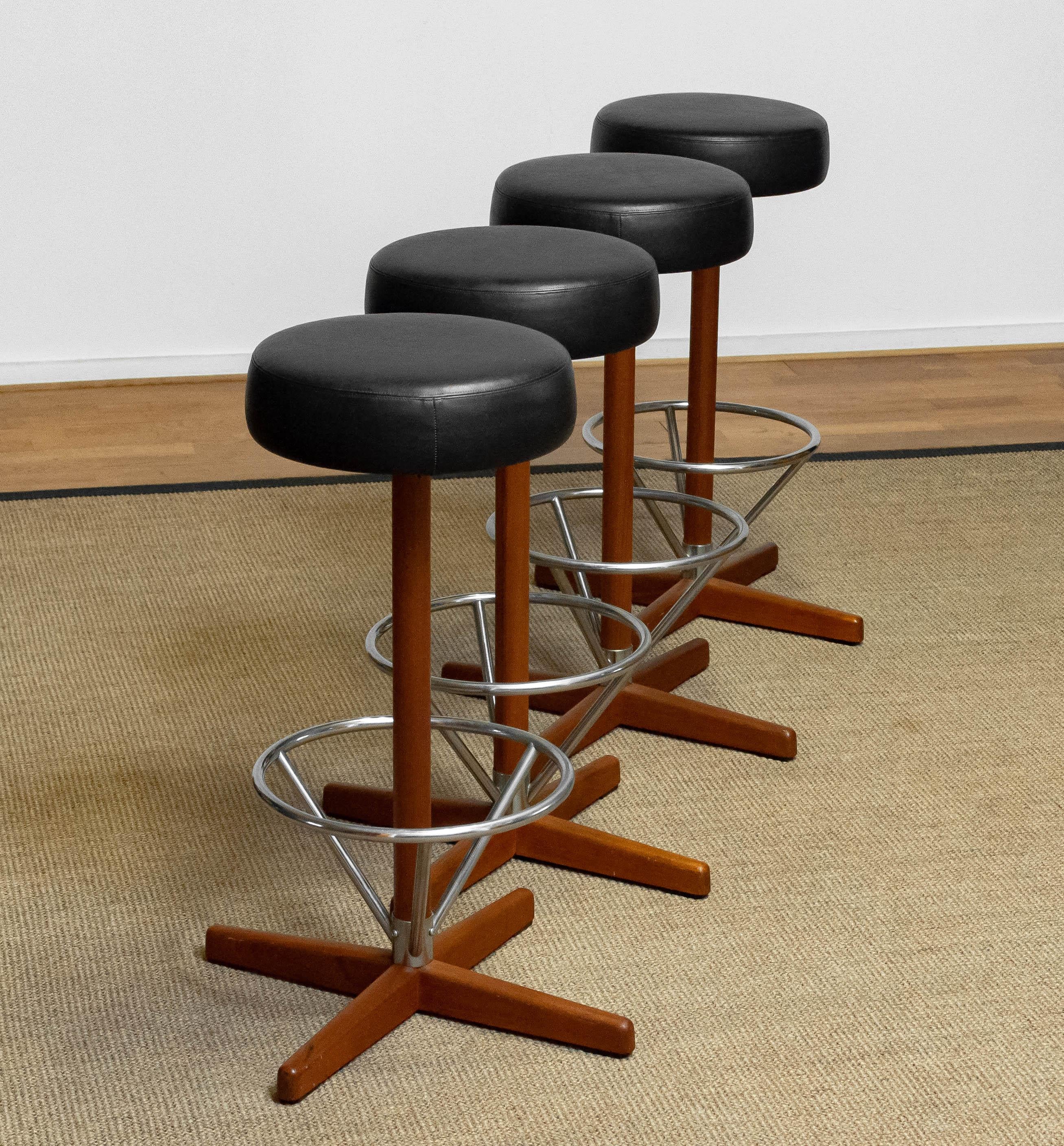 Four Teak with Chrome and Black Faux Leather Swivel Stools by Börje Johanson '60 In Good Condition In Silvolde, Gelderland