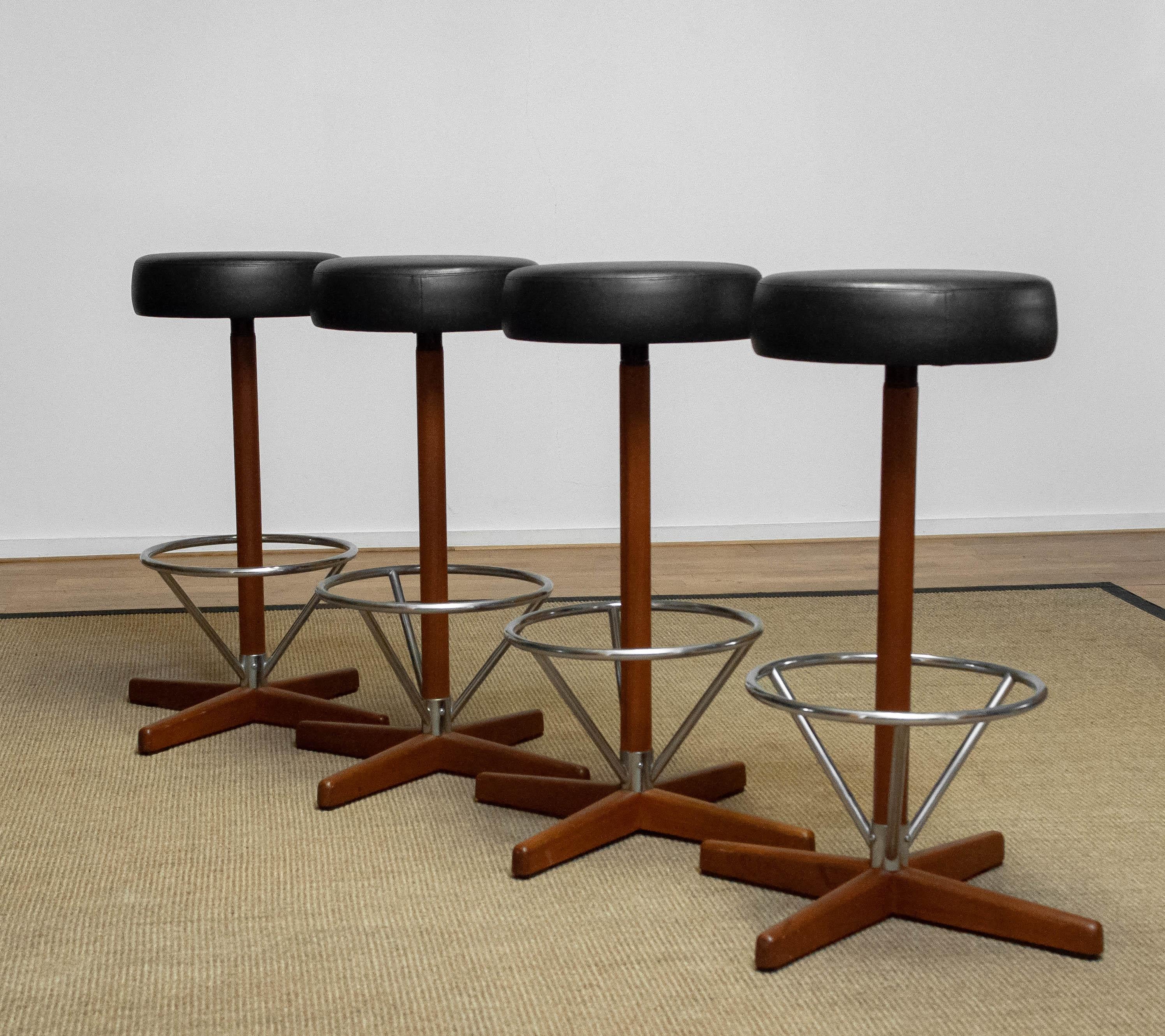 Mid-20th Century Four Teak with Chrome and Black Faux Leather Swivel Stools by Börje Johanson '60