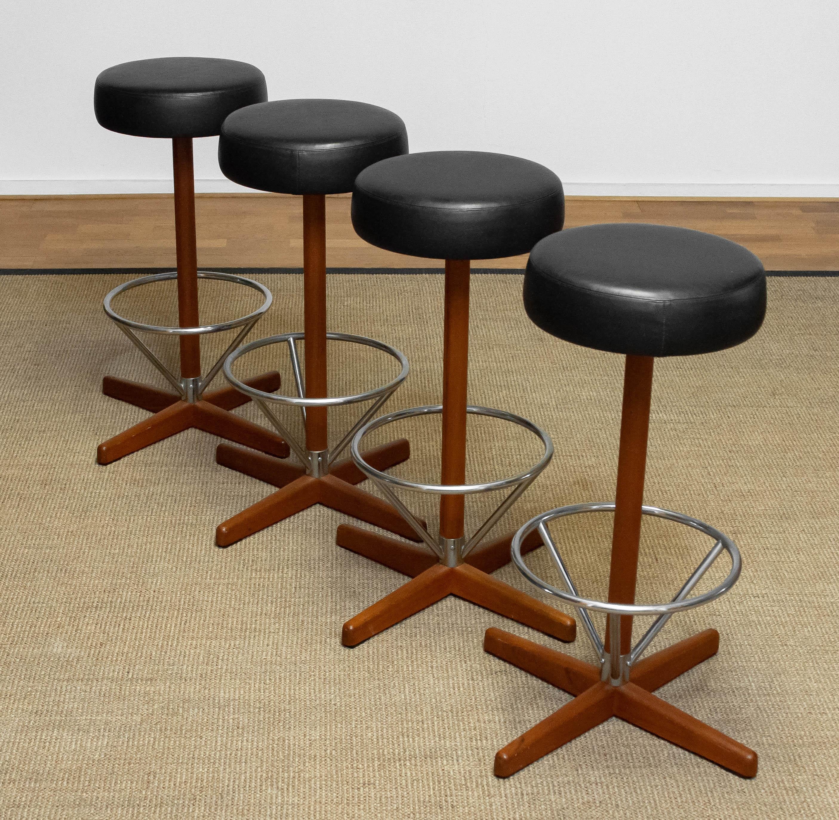 Steel Four Teak with Chrome and Black Faux Leather Swivel Stools by Börje Johanson '60