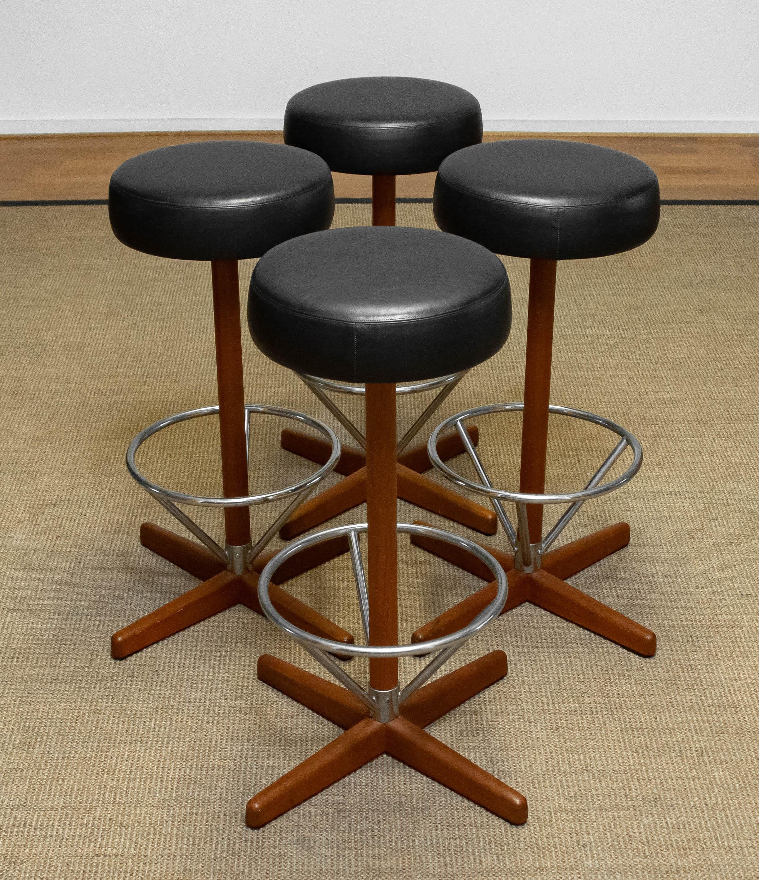 Four Teak with Chrome and Black Faux Leather Swivel Stools by Börje Johanson '60 1
