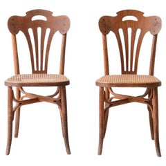 Four Thonet bent beech and perforated wood