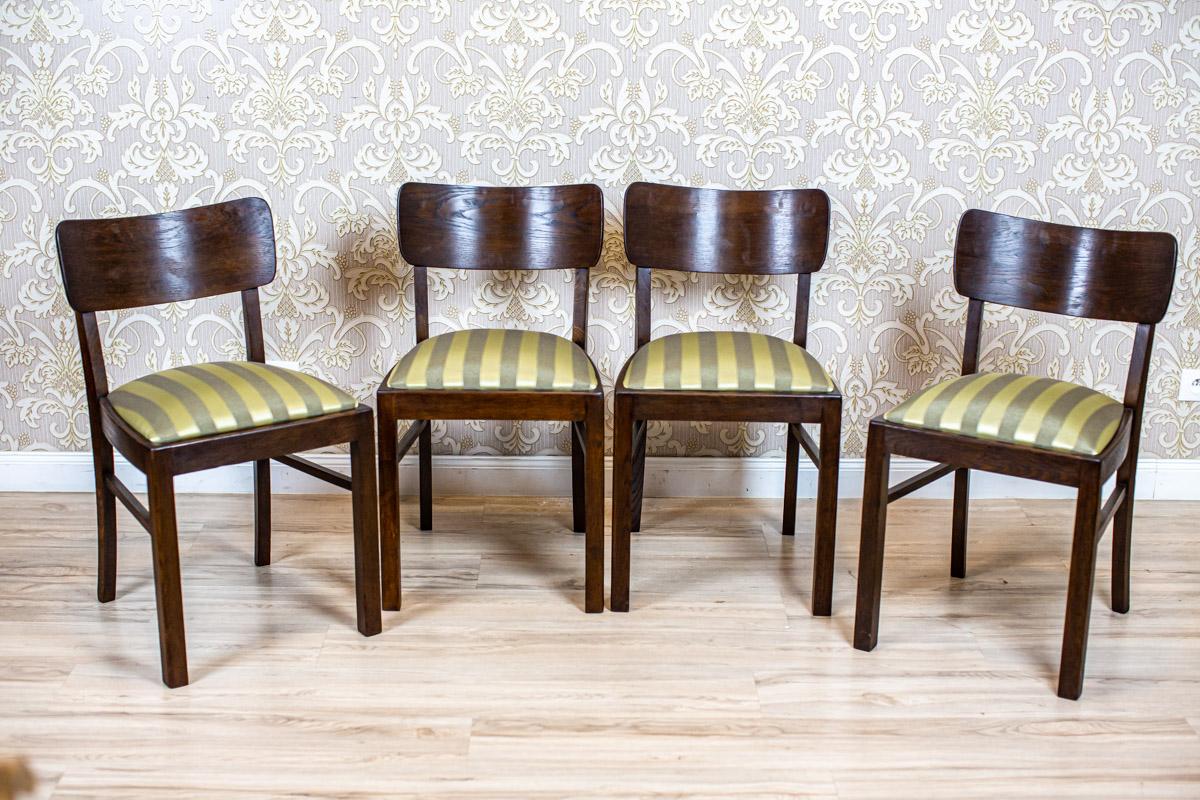 Four Art Deco Thonet Oak Chairs in Striped Upholstery

We present you four thonet chairs circa 1920/30 in the Art Deco style.
The furniture is of a simple form, made of oak wood.
The upholstered spring seats are removable.

These chairs have