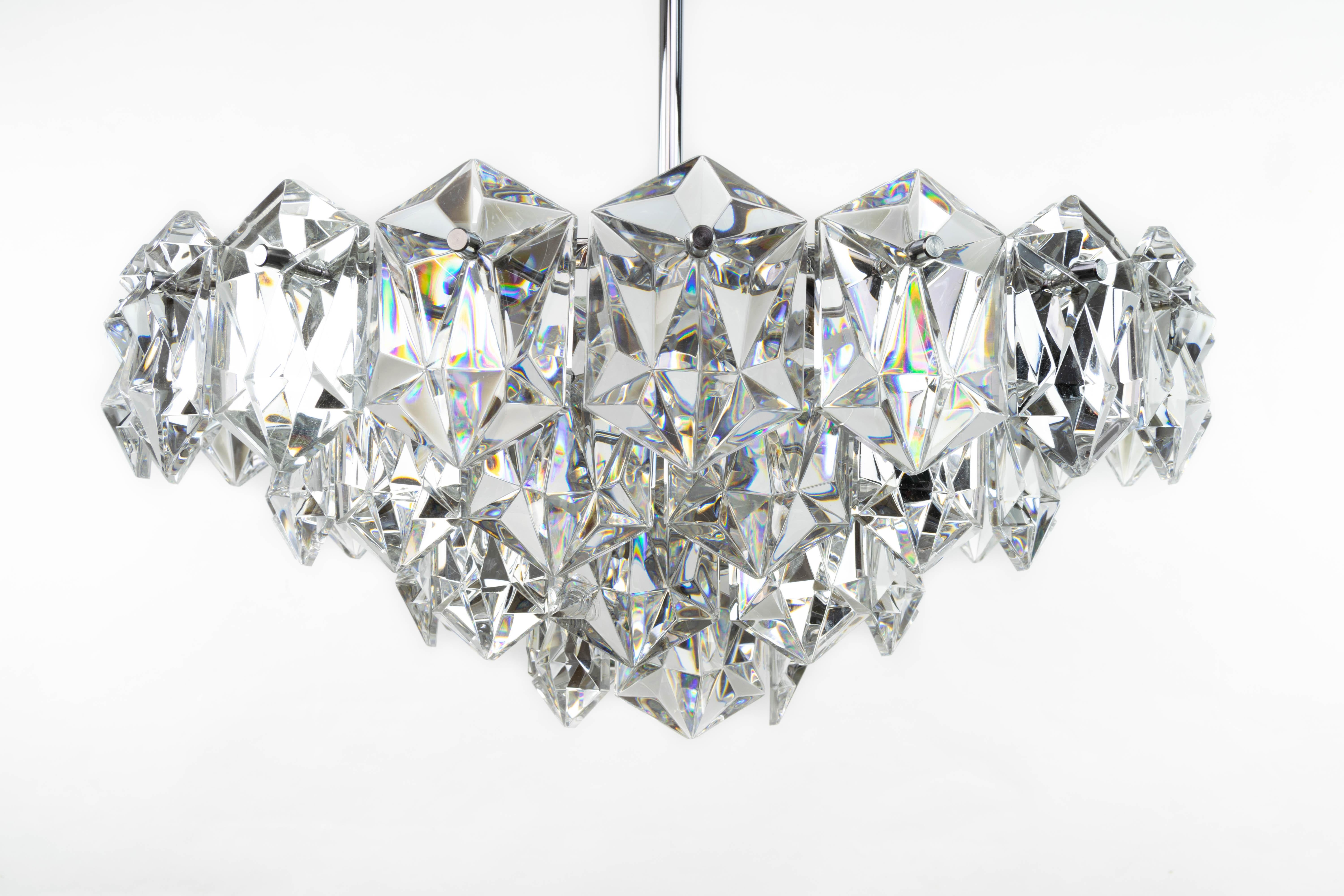 Carved Four-Tier Crystal and Steel Chrome Chandelier by Kinkeldey, Germany, 1970