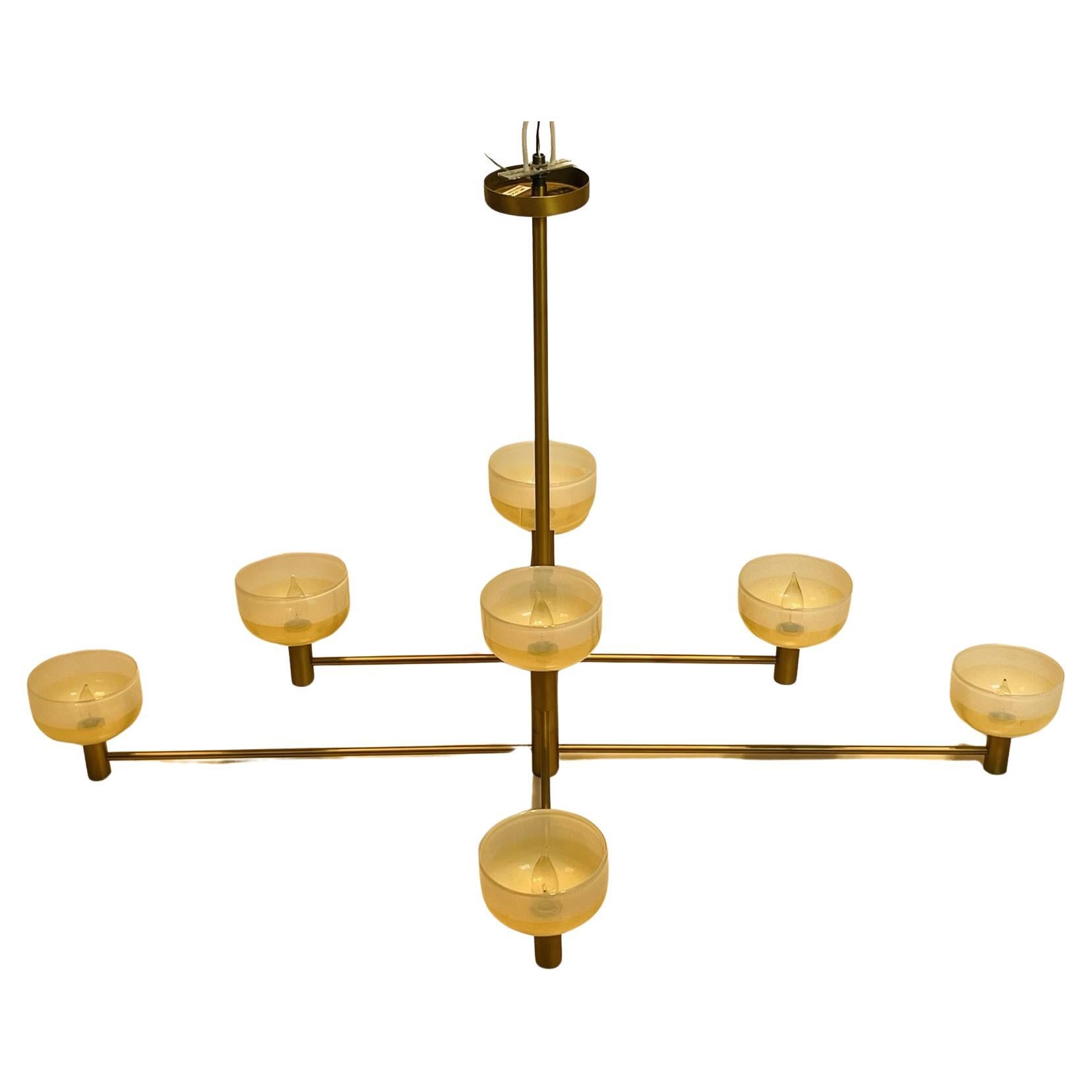 Elevate the ambiance of any room with the exquisite Four-Tier Otto Luce Chandelier by Cartwright New York, USA 2021. Crafted with precision and elegance, this stunning chandelier features a  hand milled solid brass with hand blown bowls shades